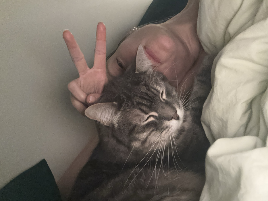 Woman and tabby cat share quiet morning moments in Paris