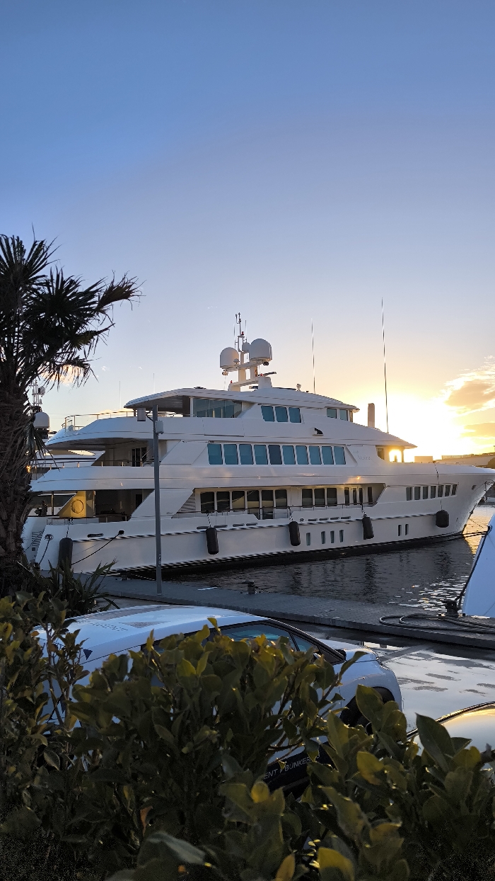 Barcelona marina sunset draws evening strollers and yacht watchers