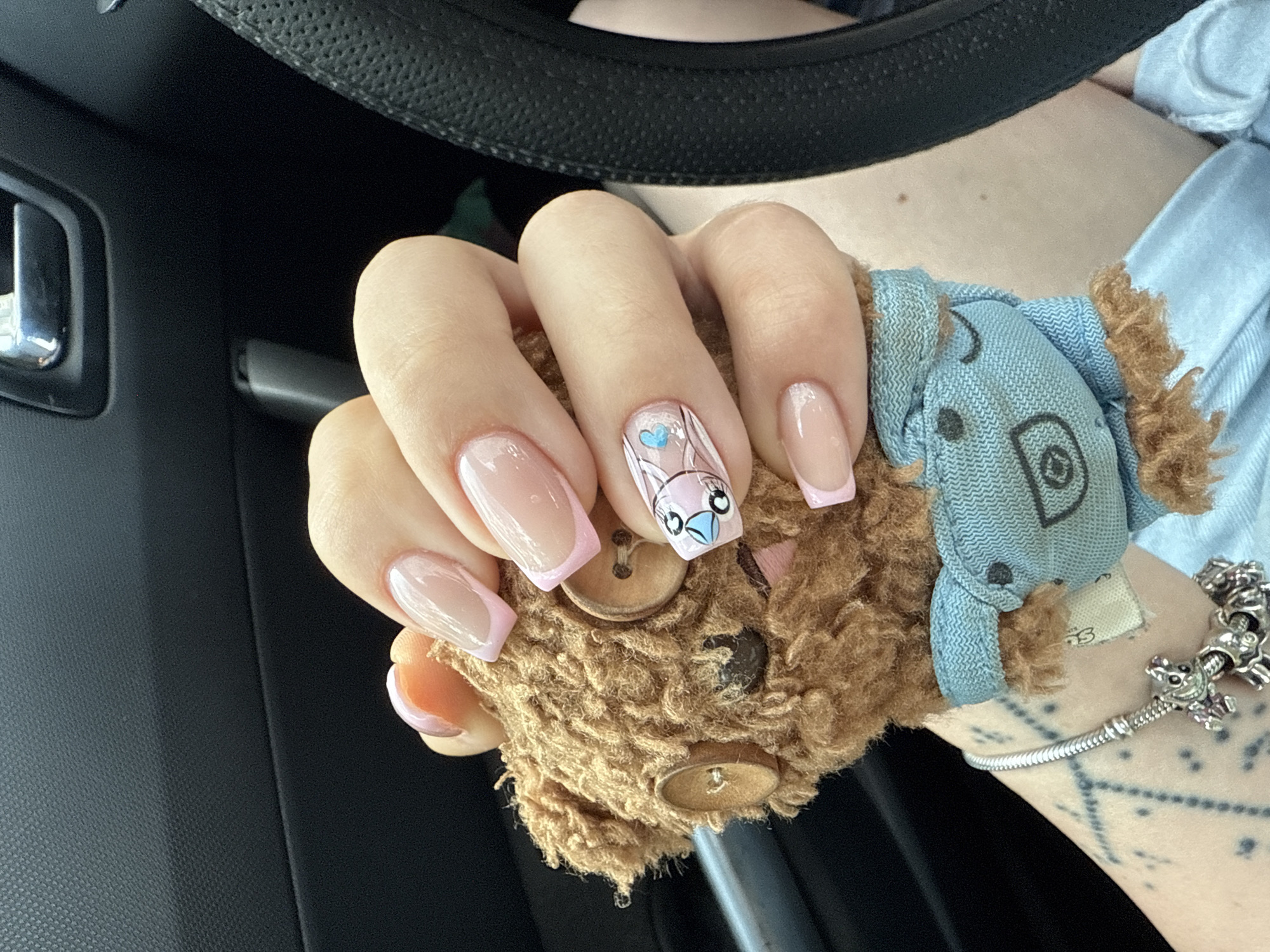 Person shows off new manicure with teddy bear in Bulgaria