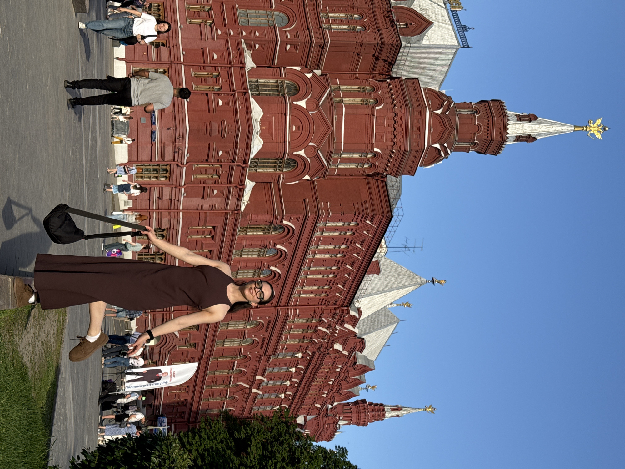 Woman poses with outstretched arms at Moscow Historical Museum