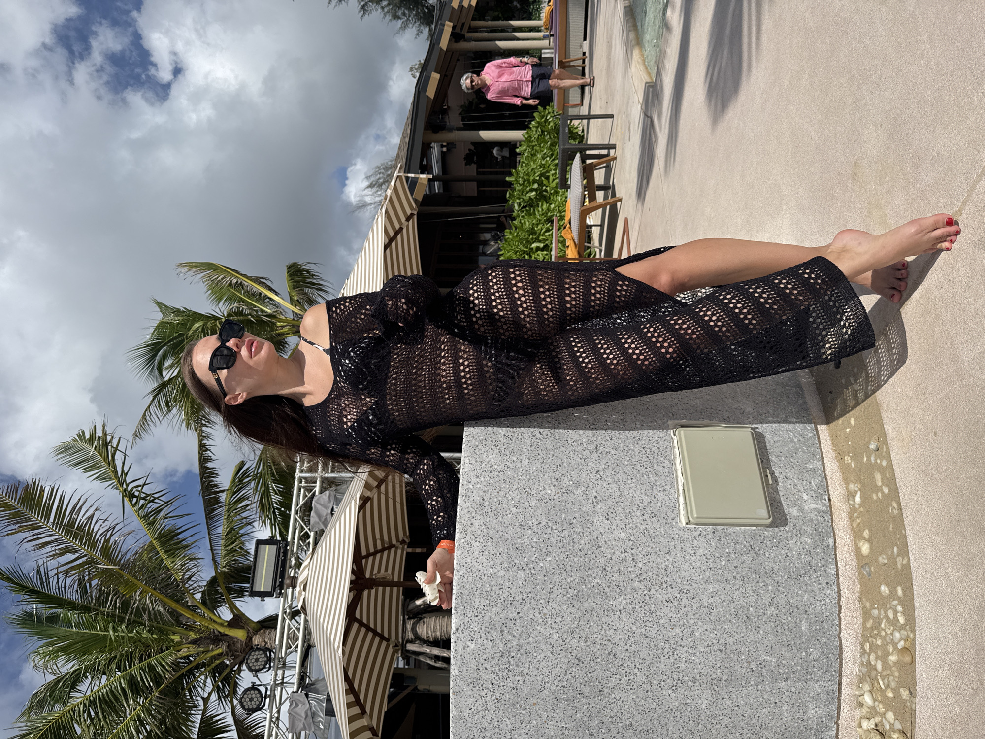 Woman poses at outdoor venue in Choeng Thale, Thailand
