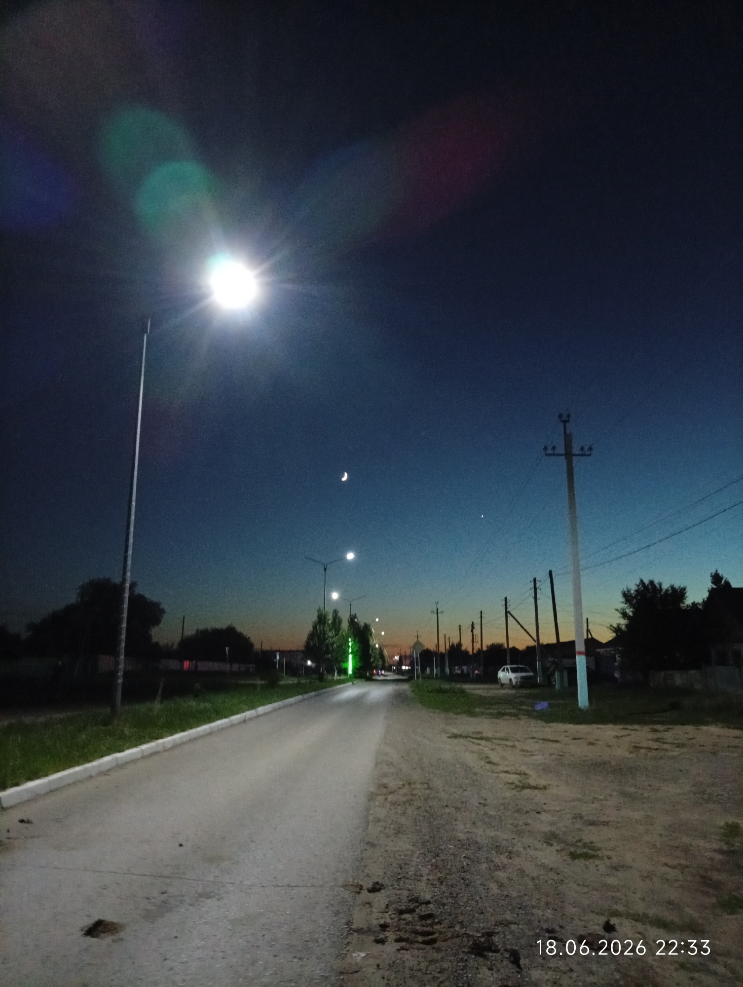 Dusk settles over the quiet streets of Qobda, Kazakhstan