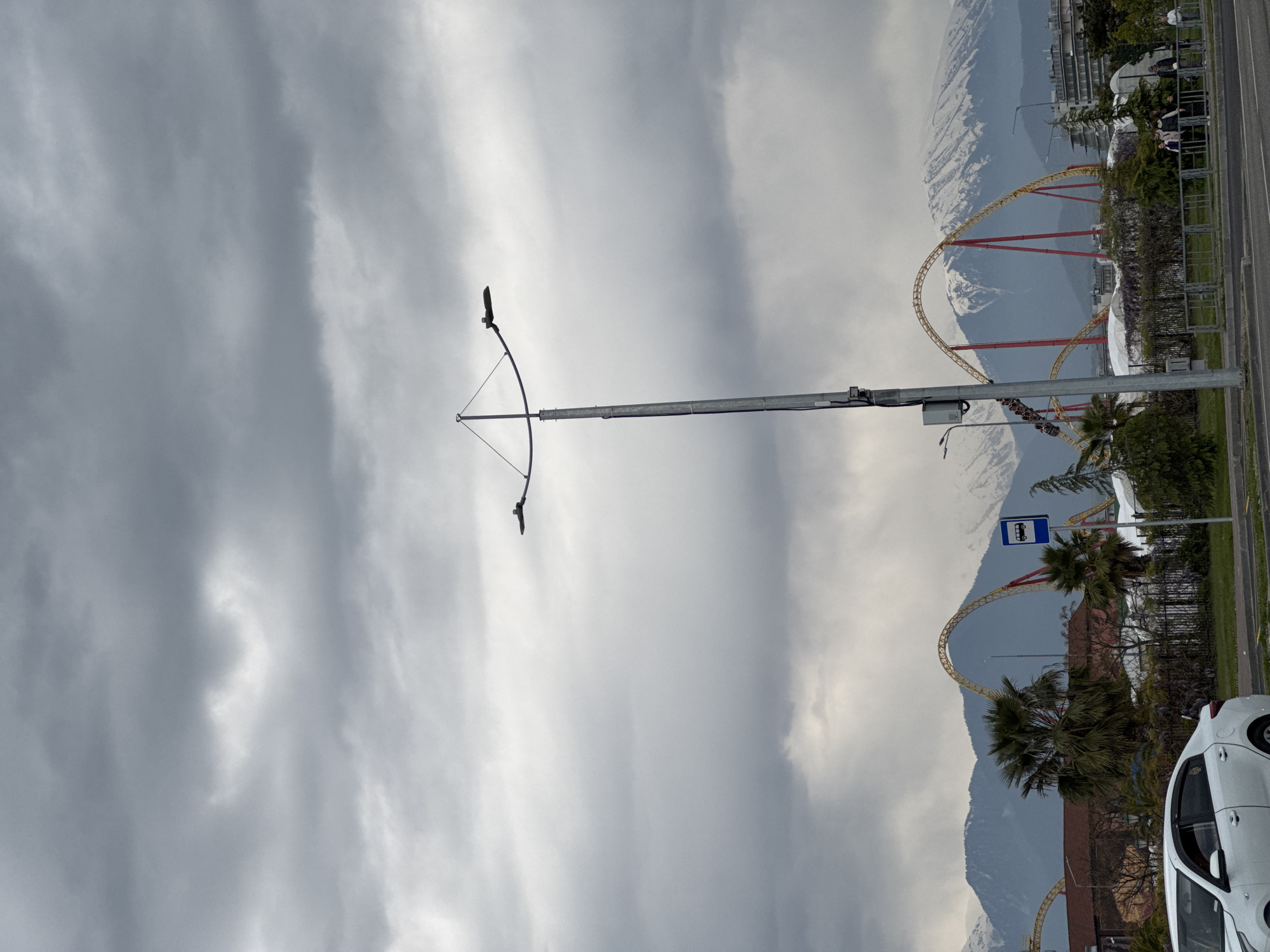 Overcast day captures street life near Sirius amusement park