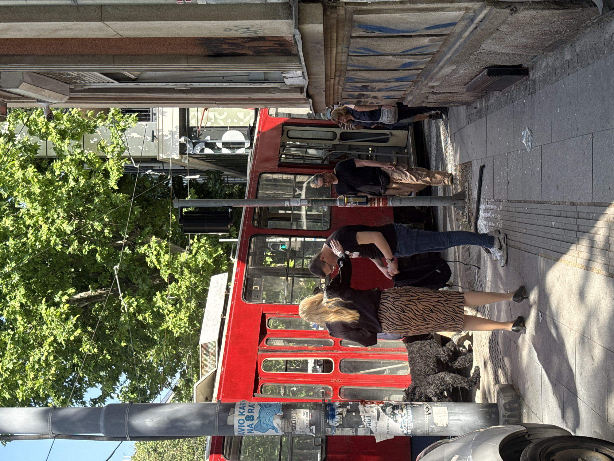 Red tram crashes into Belgrade building, witnesses gather