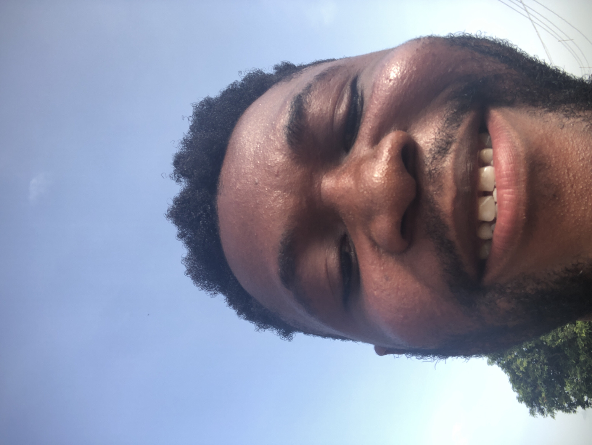 Man photographed smiling in multiple shots at unknown location