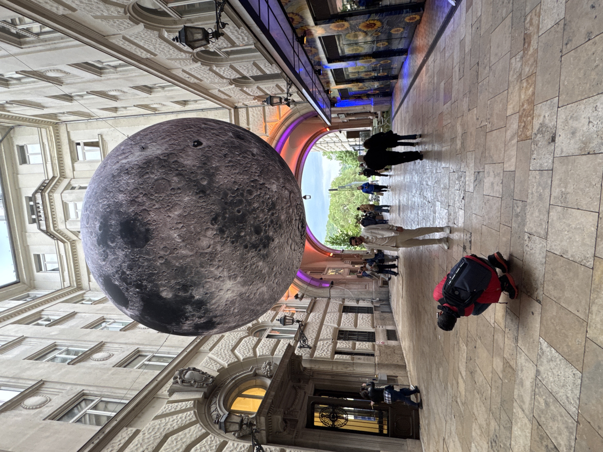 Giant inflatable moon art installation draws crowds in Budapest