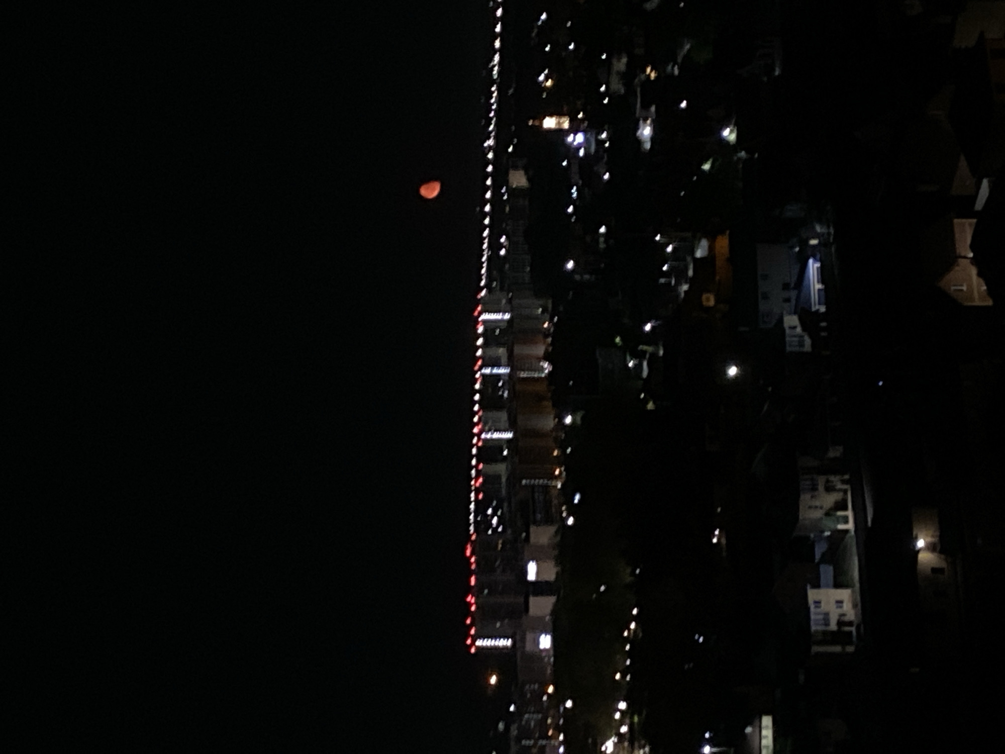 Nighttime skyline and moon observed in Kazan, Russia