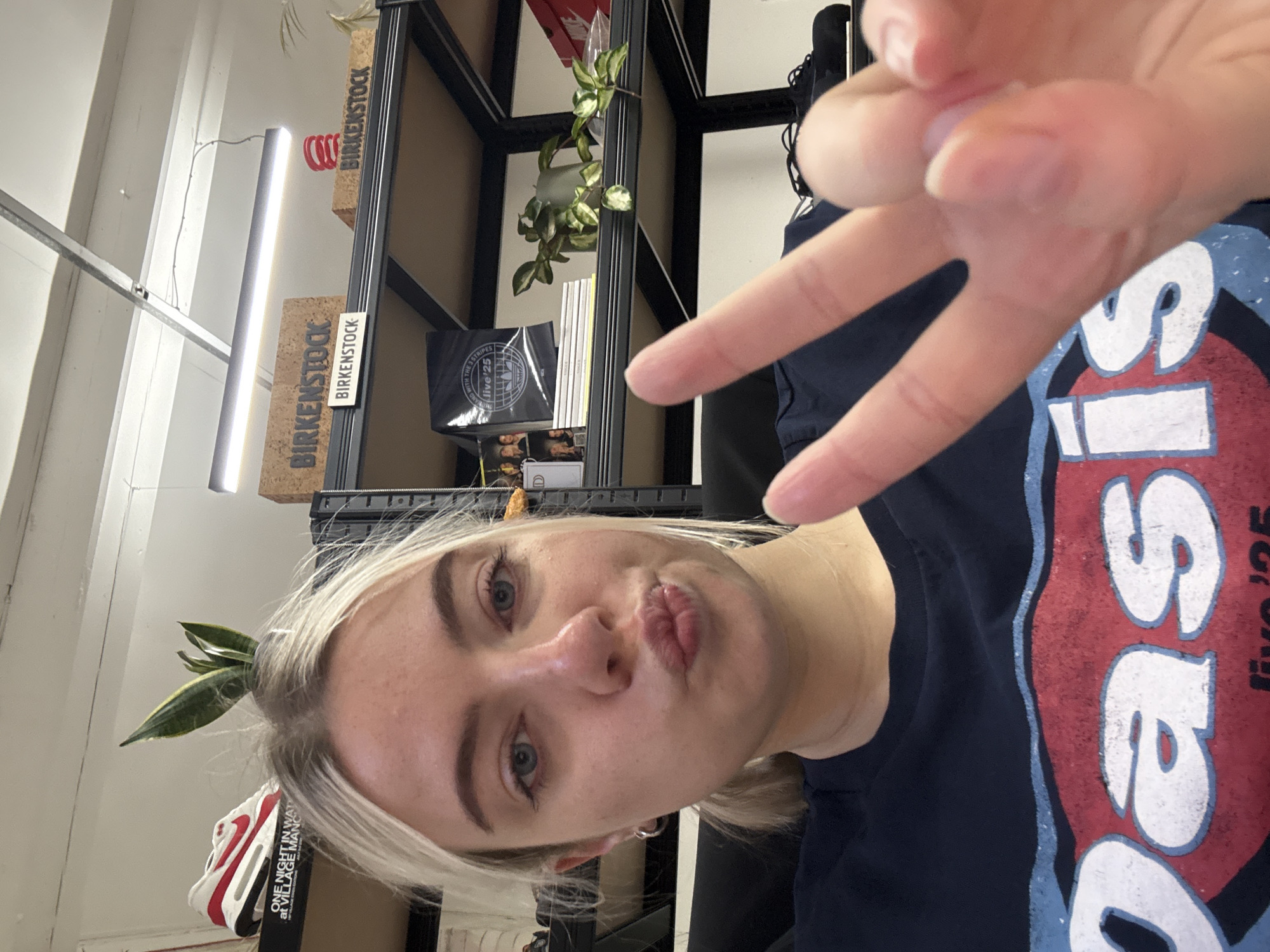 Woman takes selfie amid personal items in Manchester