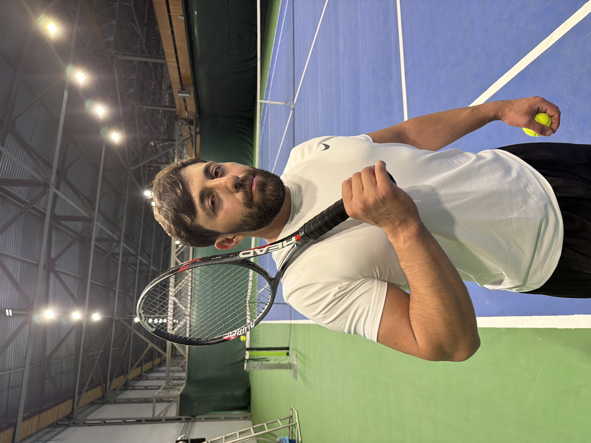 Tennis practice session documented at Krasnoyarsk indoor court facility