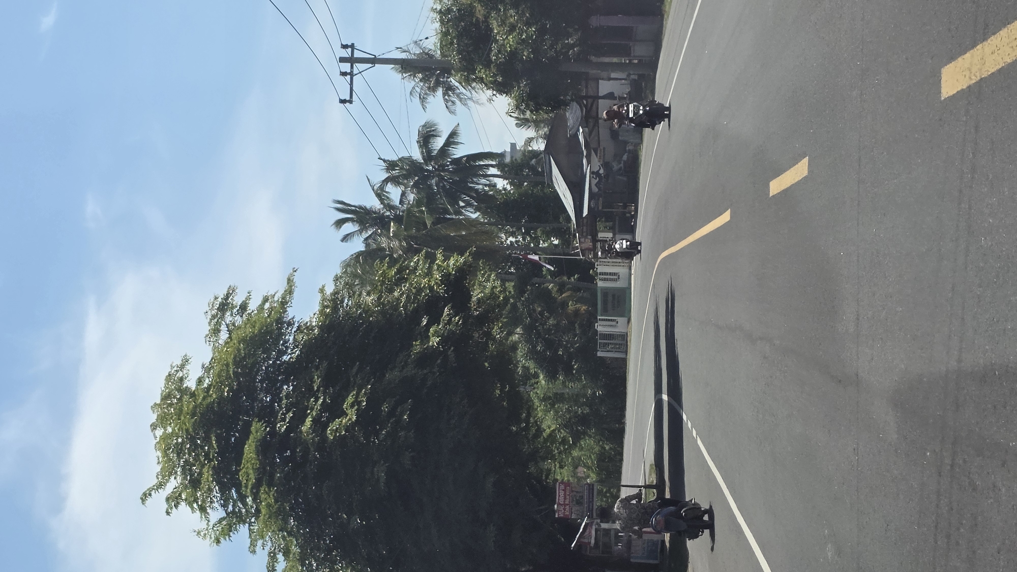 Motorcycles spotted on curved road in Paya Tringgadeng, Indonesia