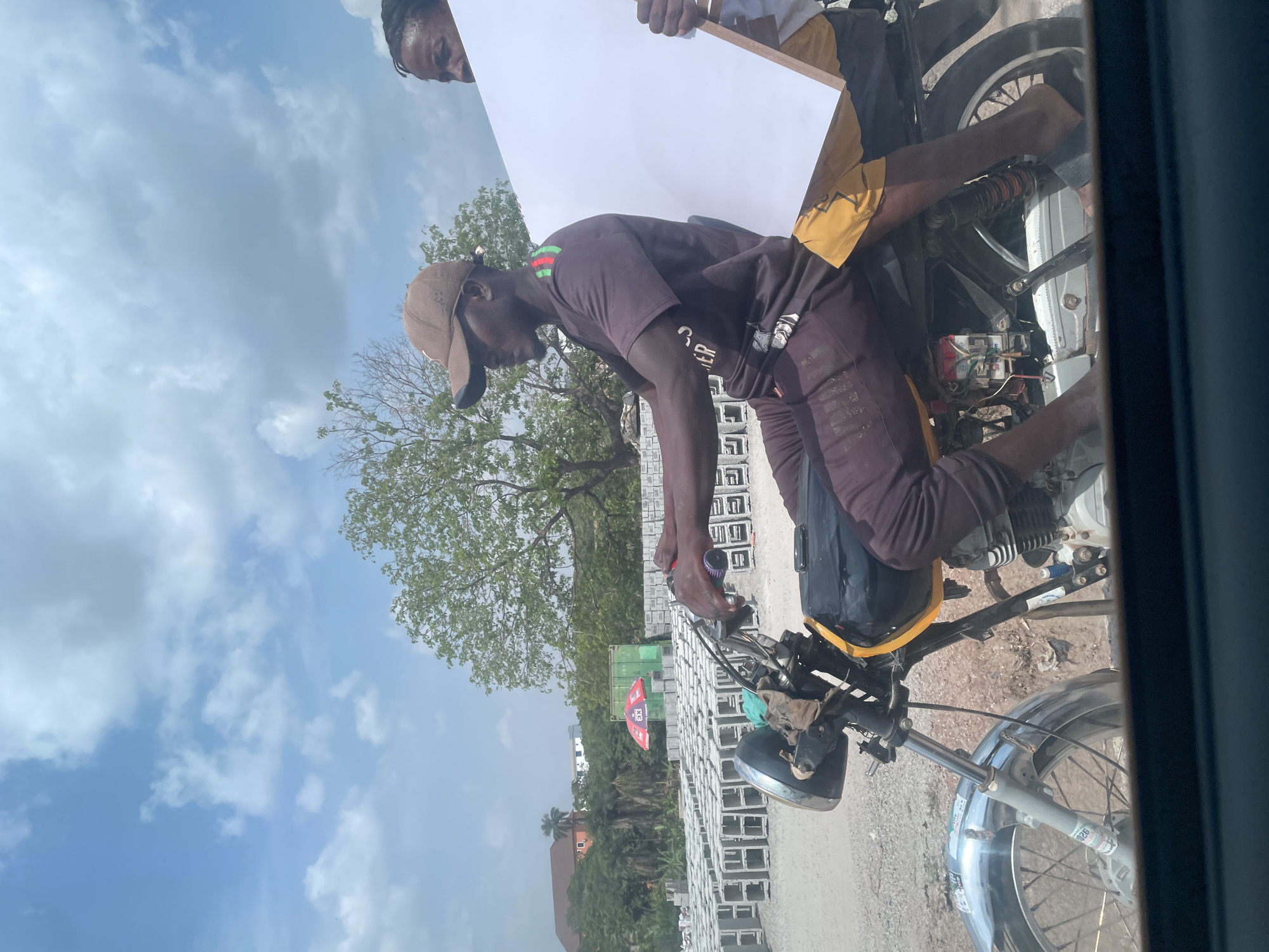 Casual daily life documented across Abuja neighborhoods during afternoon