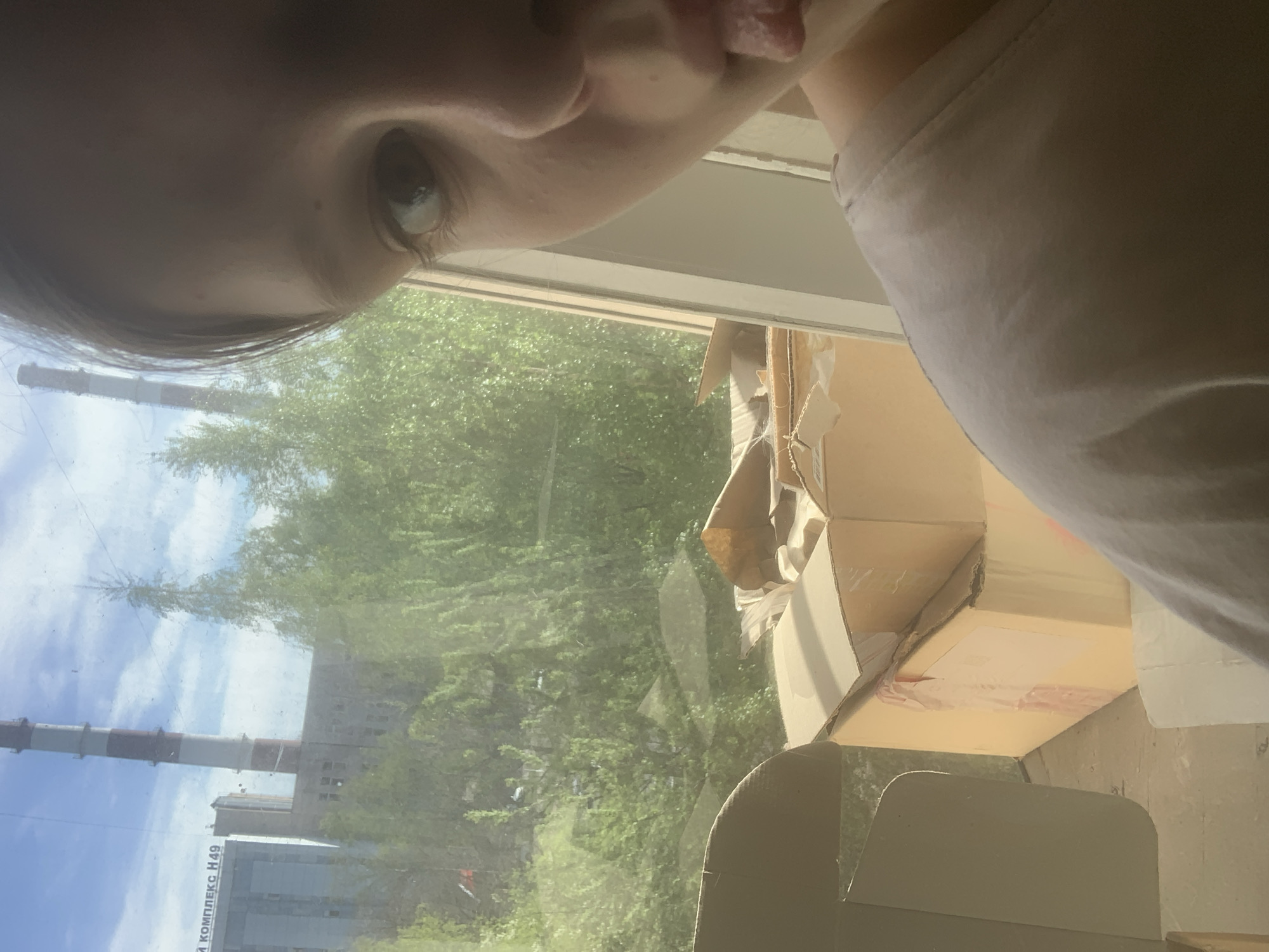 Person documents afternoon moments indoors in Russian suburb