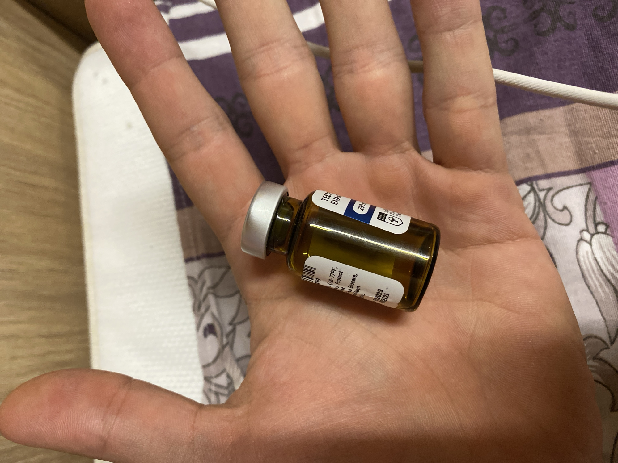 Man photographed with amber vial in Koskolovo, Russia