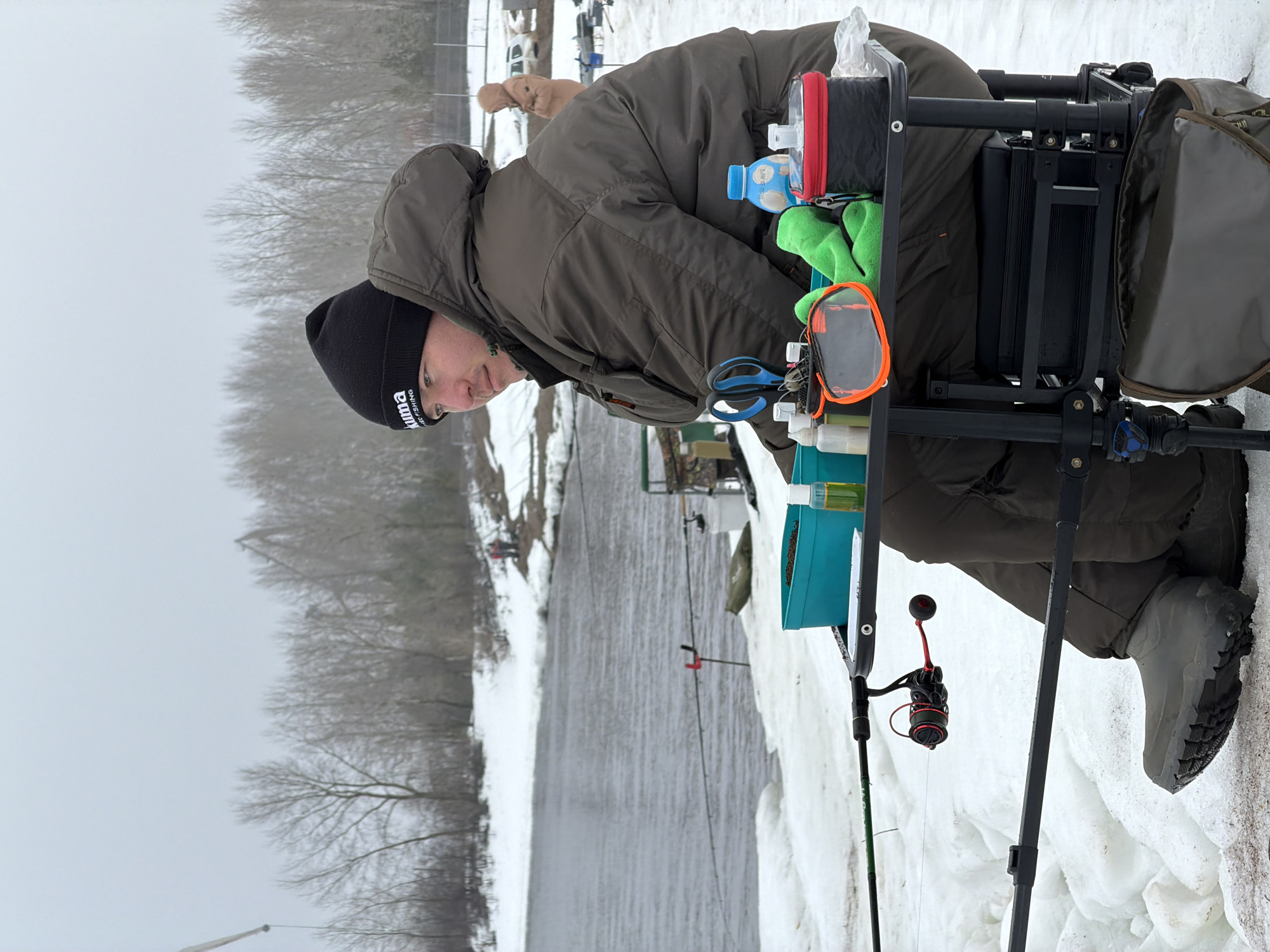 Winter fishing observed along riverbank in Chaikovsky, Russia