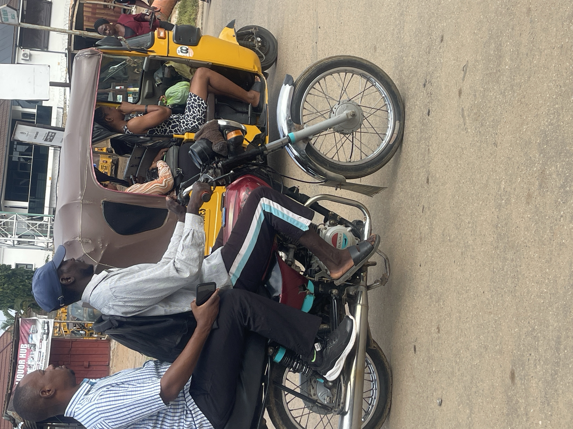 Morning motorcycle traffic and street life in Abuja