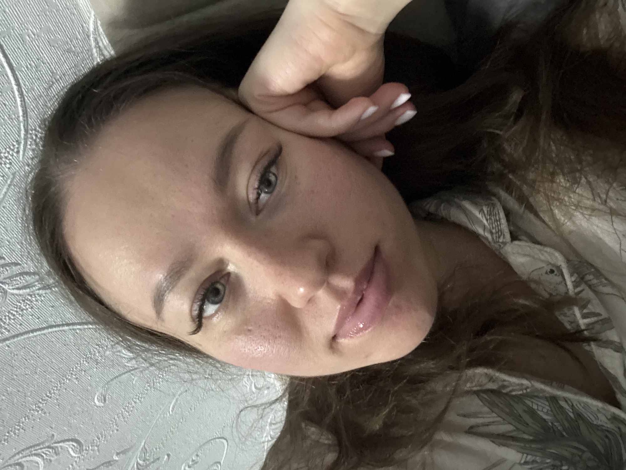 Woman takes indoor selfie portrait in Ferma, Russia