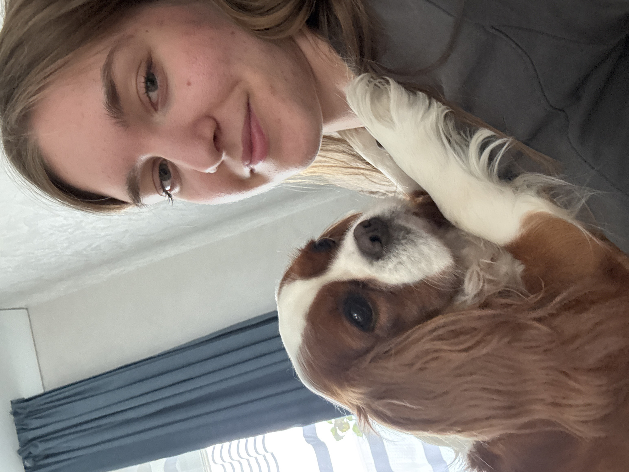 Woman enjoys morning cuddle session with pets in Russia