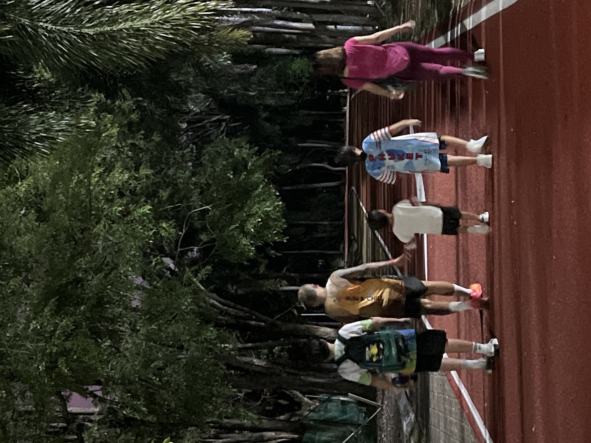 Daily life captured across Phuket: running, tourism signs, evening gatherings