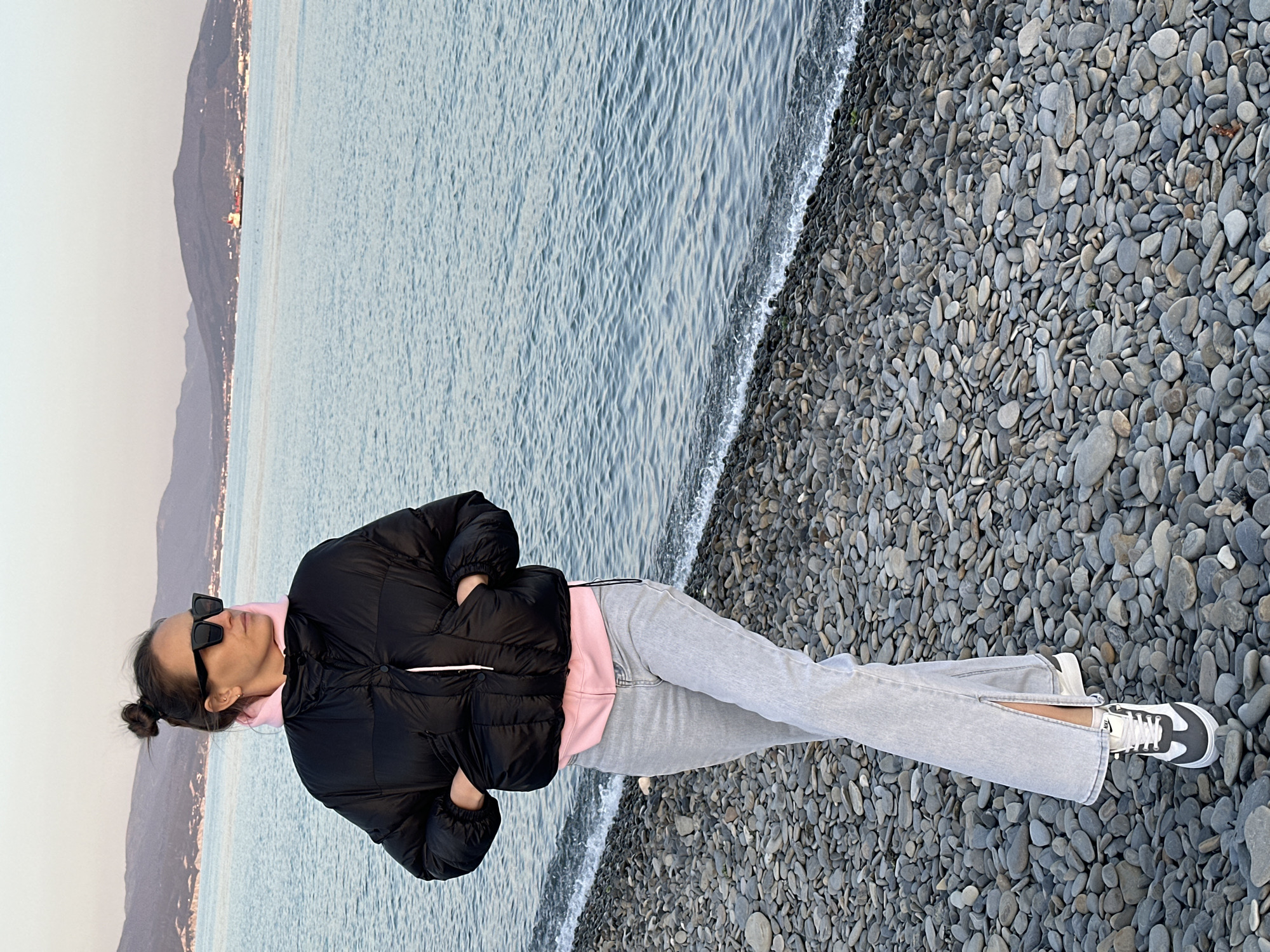Woman in casual attire stands on Novorossiysk beach