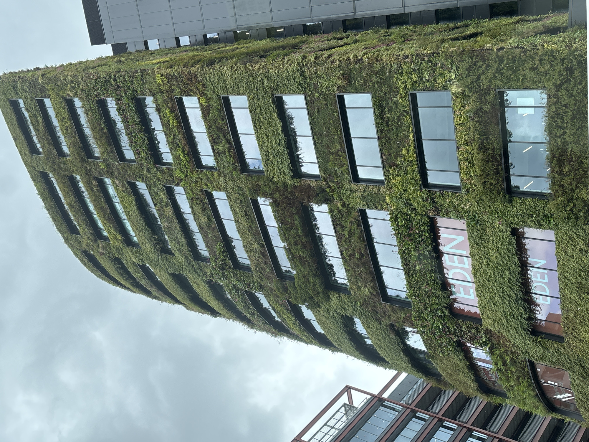 Modern green-facade building documented in Salford