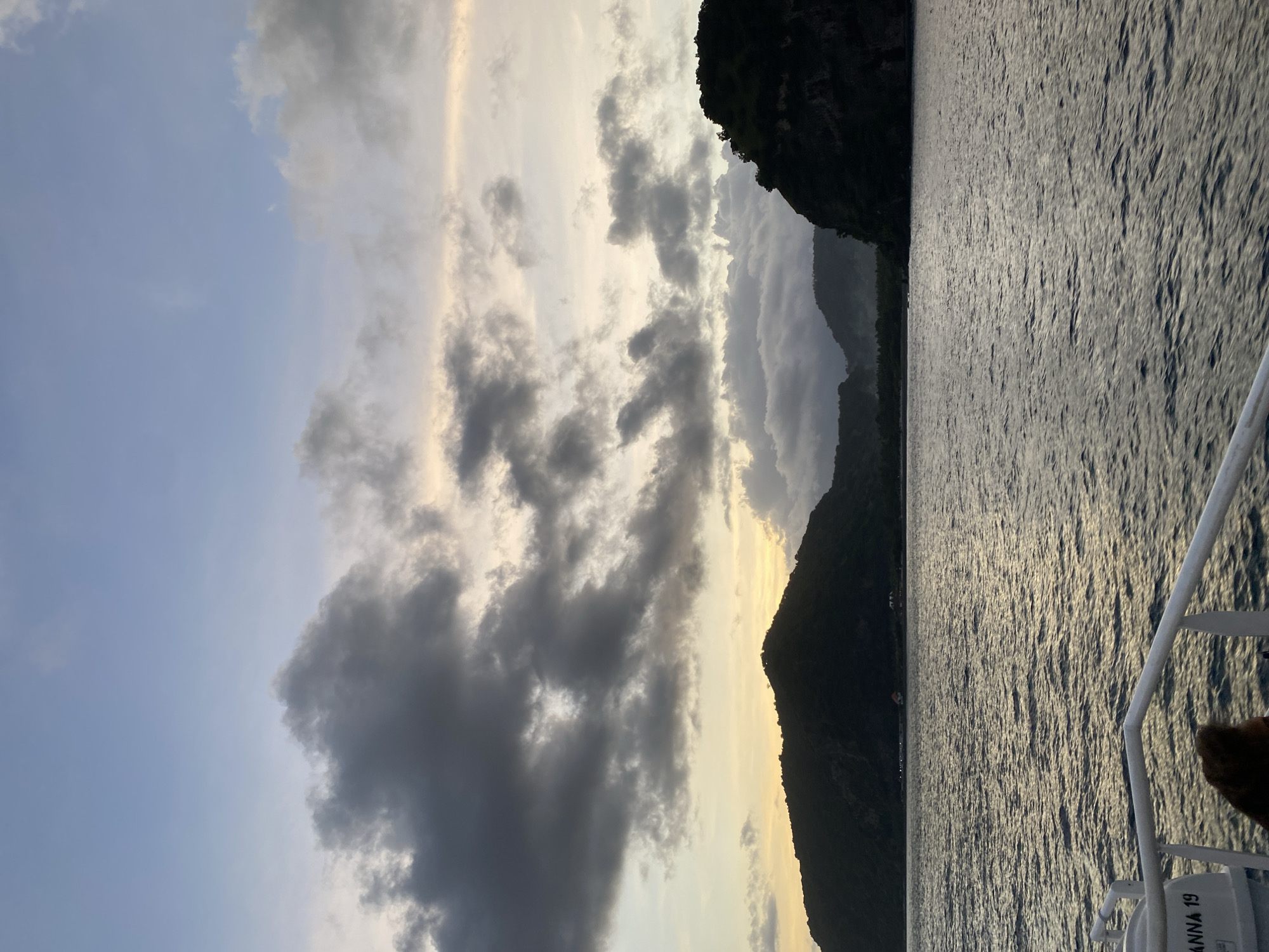 Boat journey captured off Karangasem coast under cloudy skies