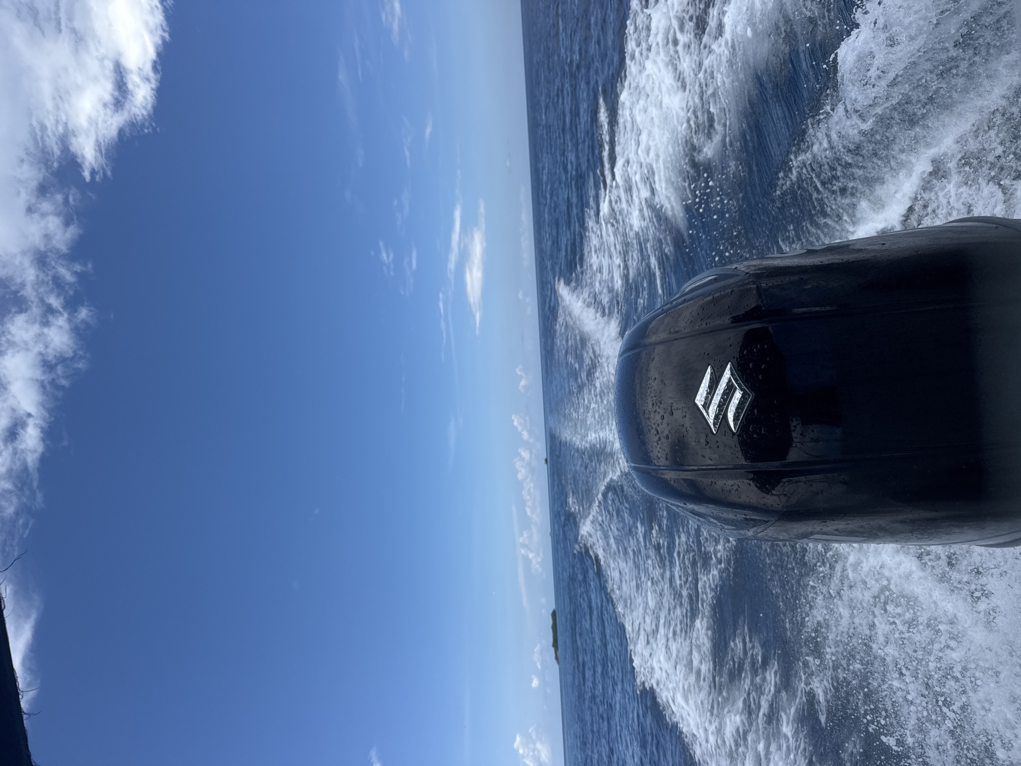 Motorboat travels ocean waters near Rasdhoo, Maldives morning