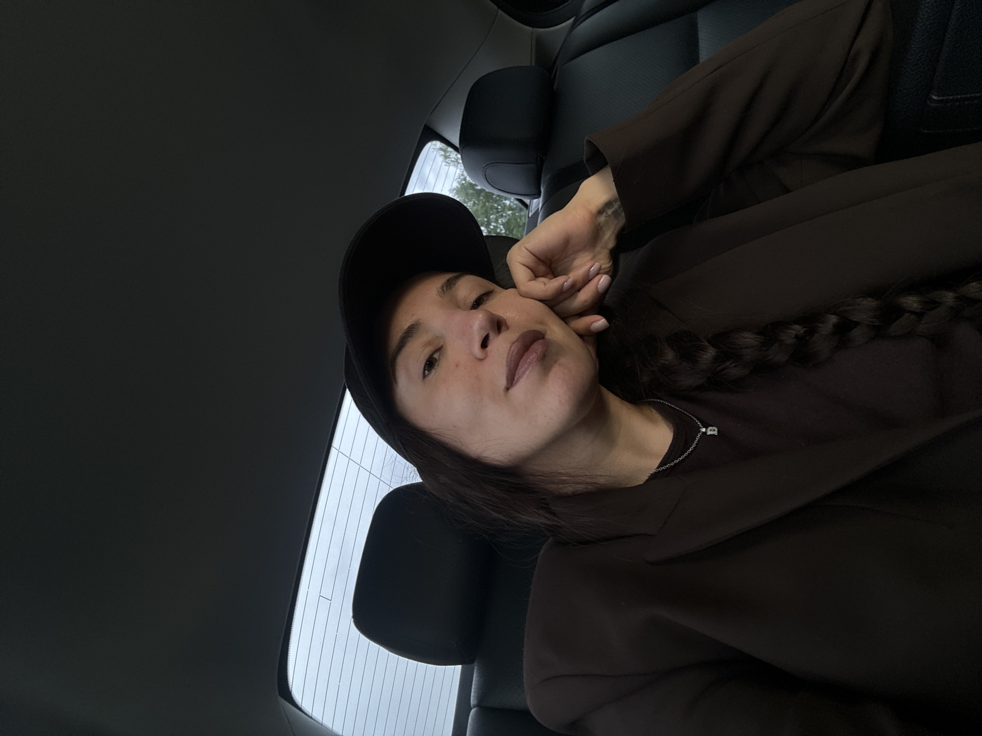 Woman in dark attire observed in vehicle in Moscow