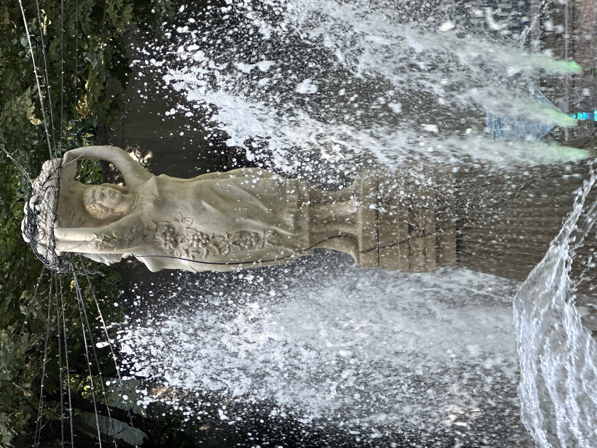Stone sculpture and terraced waterfall at a Tashkent public space
