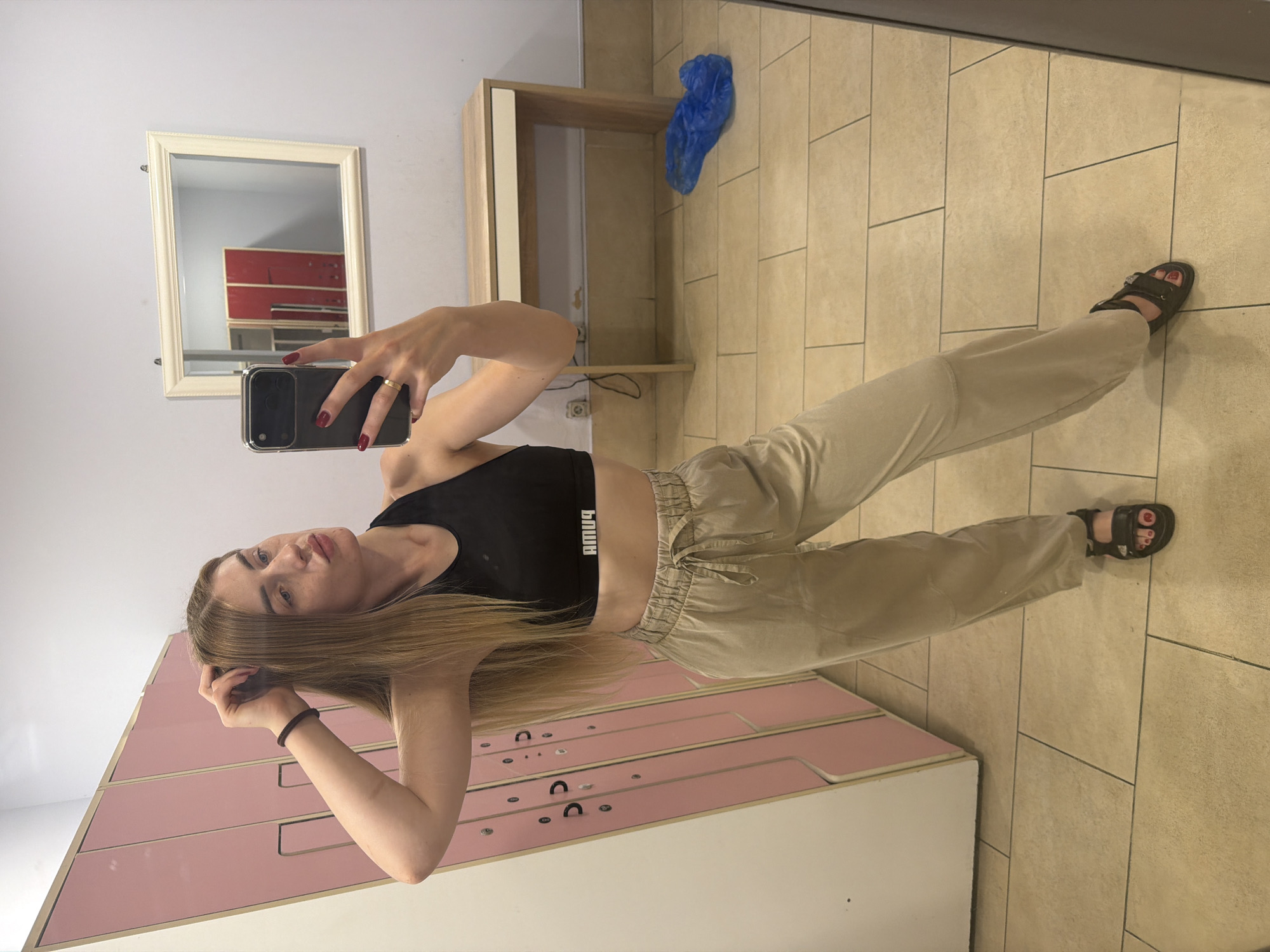 Locker room mirror selfie in athletic wear