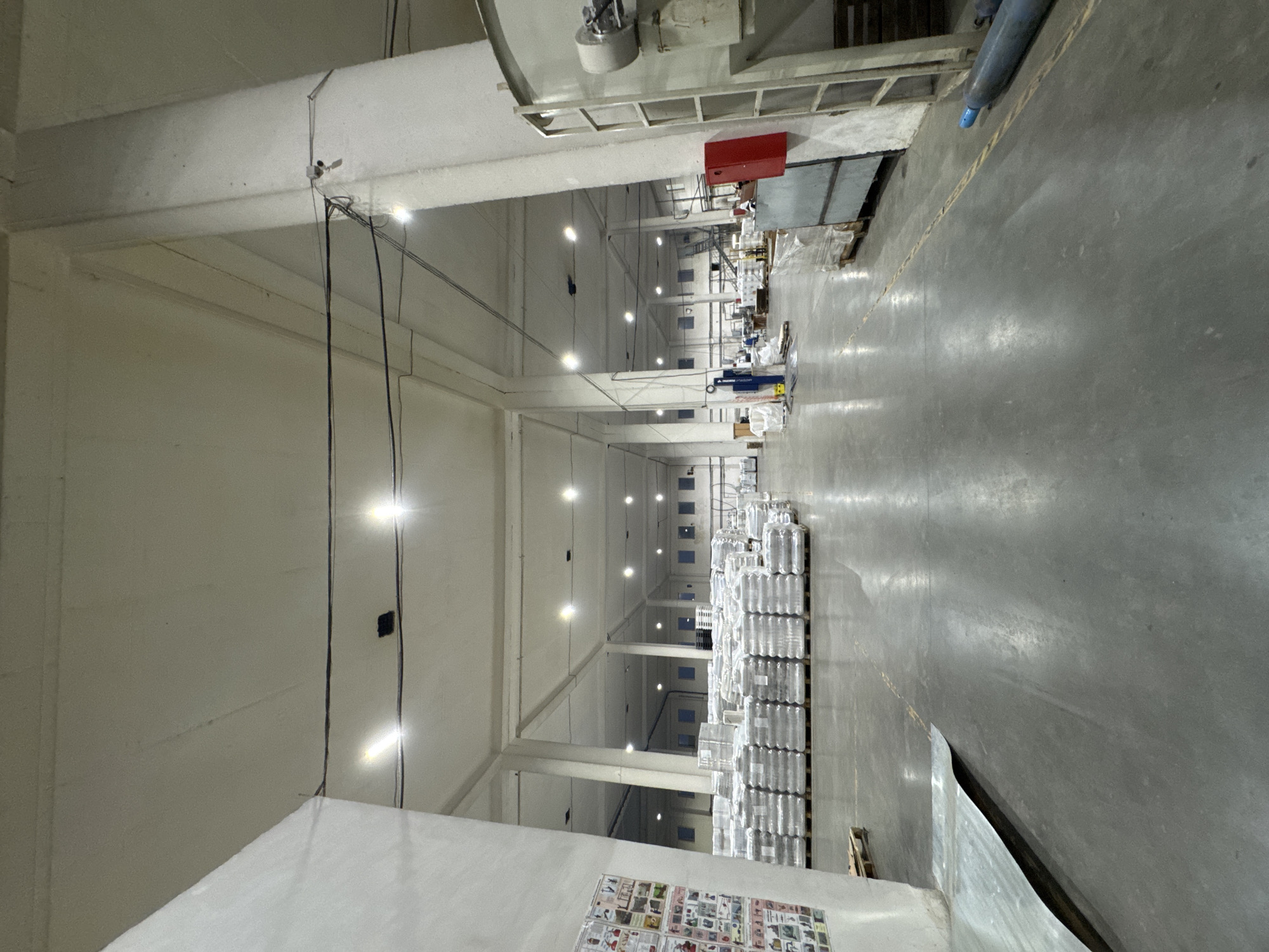 Inside and outside a Perm plastics facility at dusk
