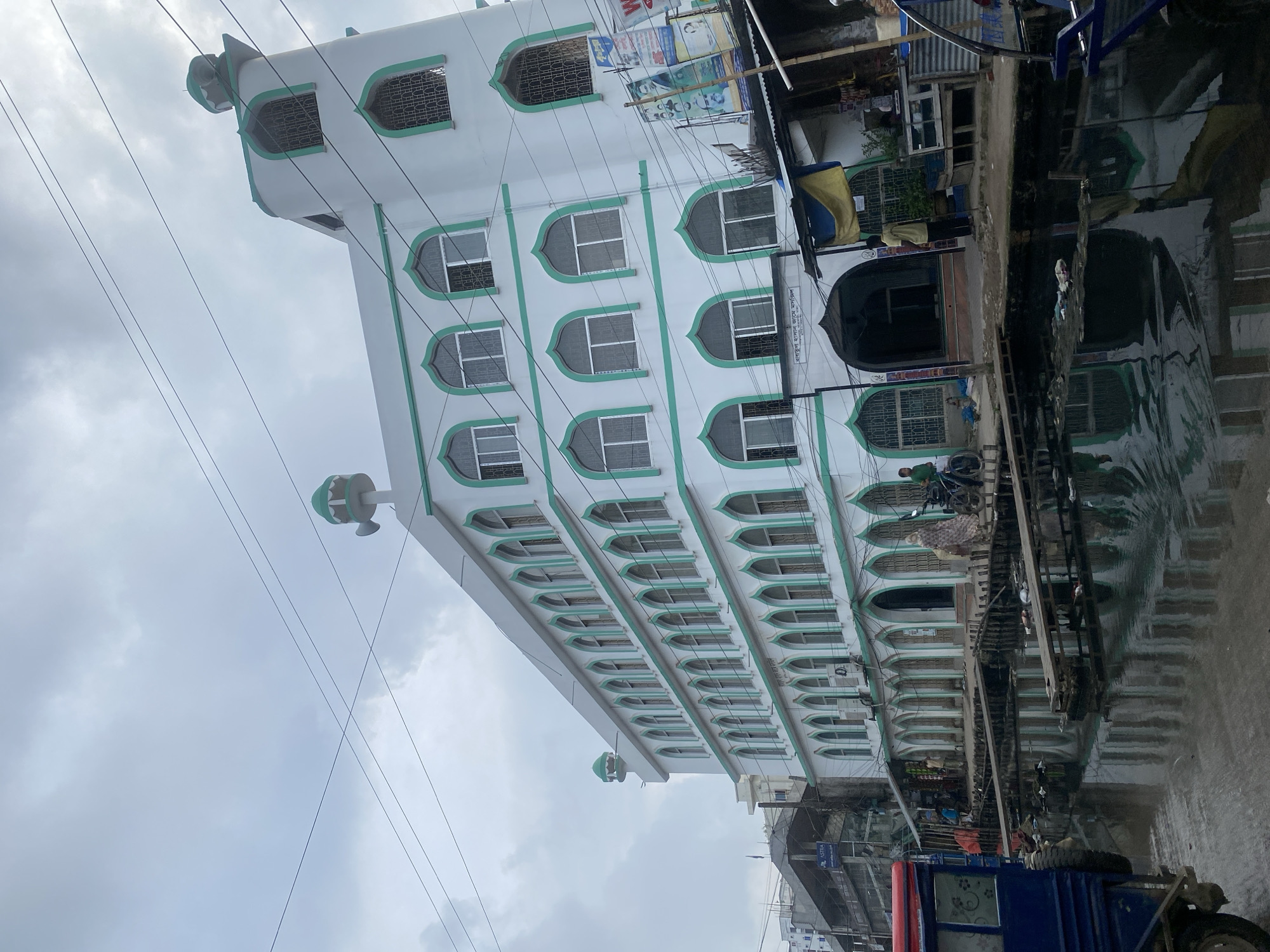 Everyday street life in a dense Dhaka neighborhood