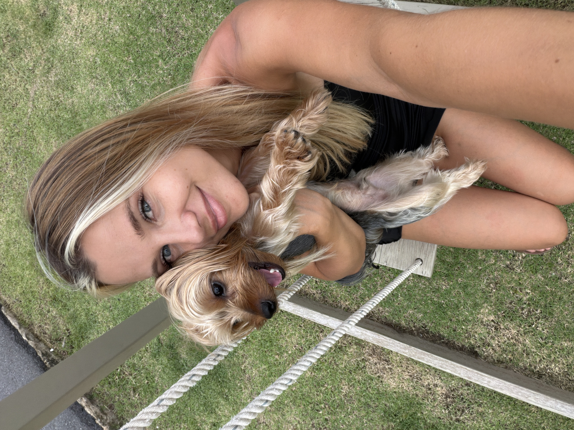 Goofing around with a Yorkshire Terrier outdoors in Thailand