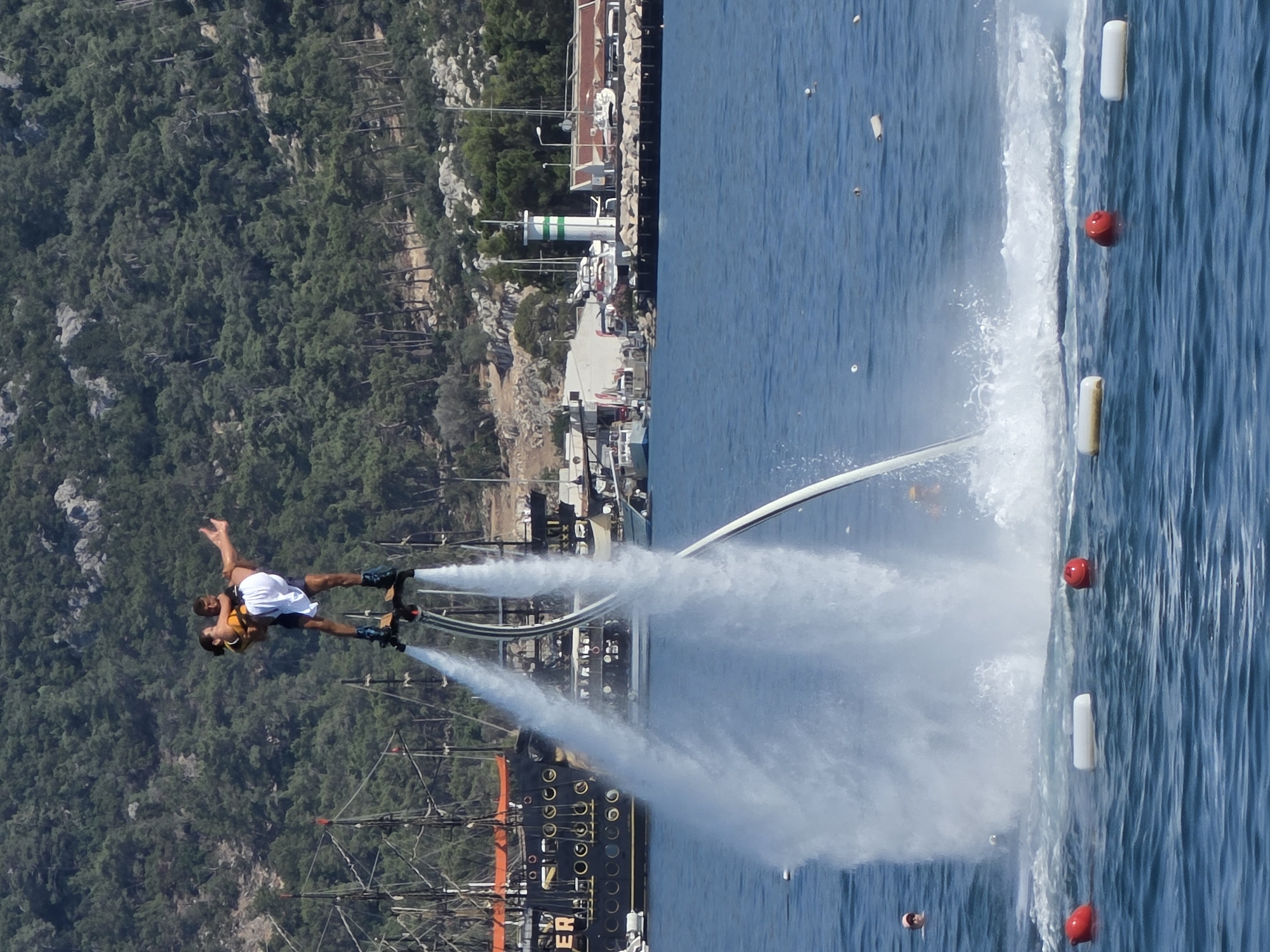 Resort day in Kemer: pool aerobics, flyboarding, and coastal cruising