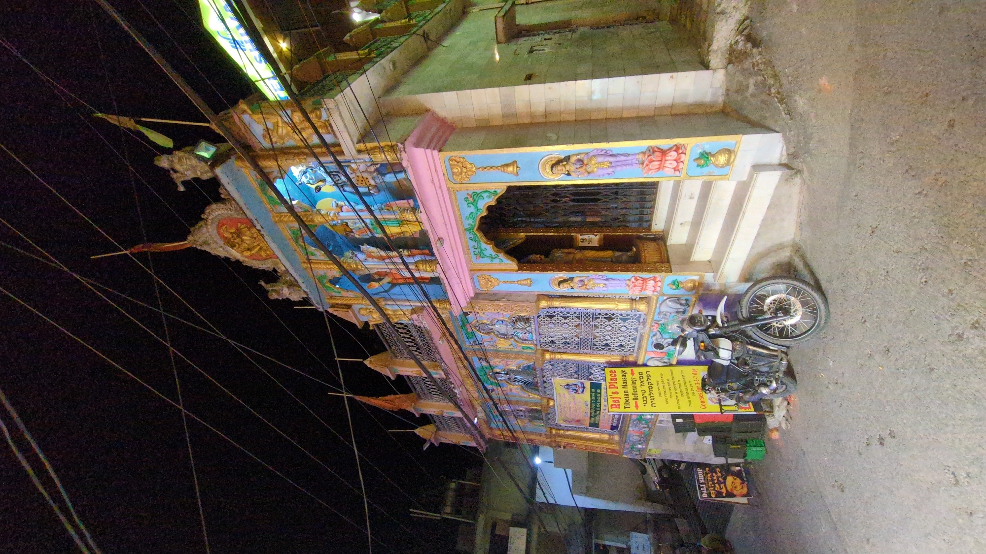 Colorfully lit building documented in Bhagsu, India