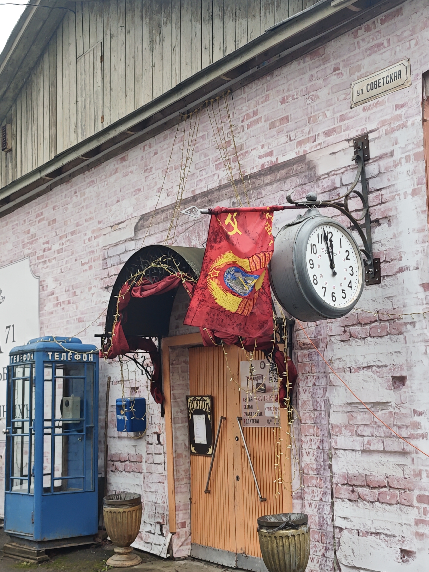 Street scenes documented in Ольгово, Russia show Soviet-era architecture