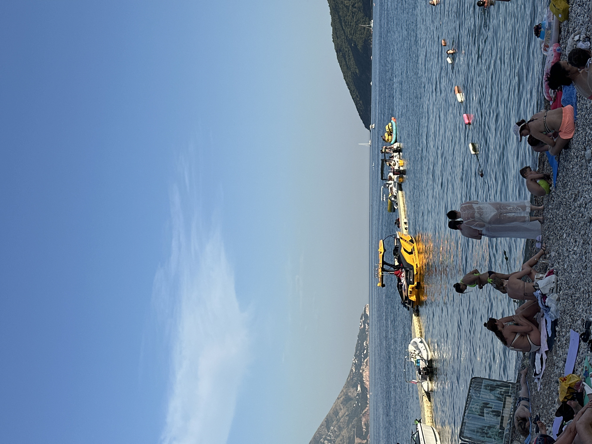 Sunny afternoon at Budva's pier and pebble beaches