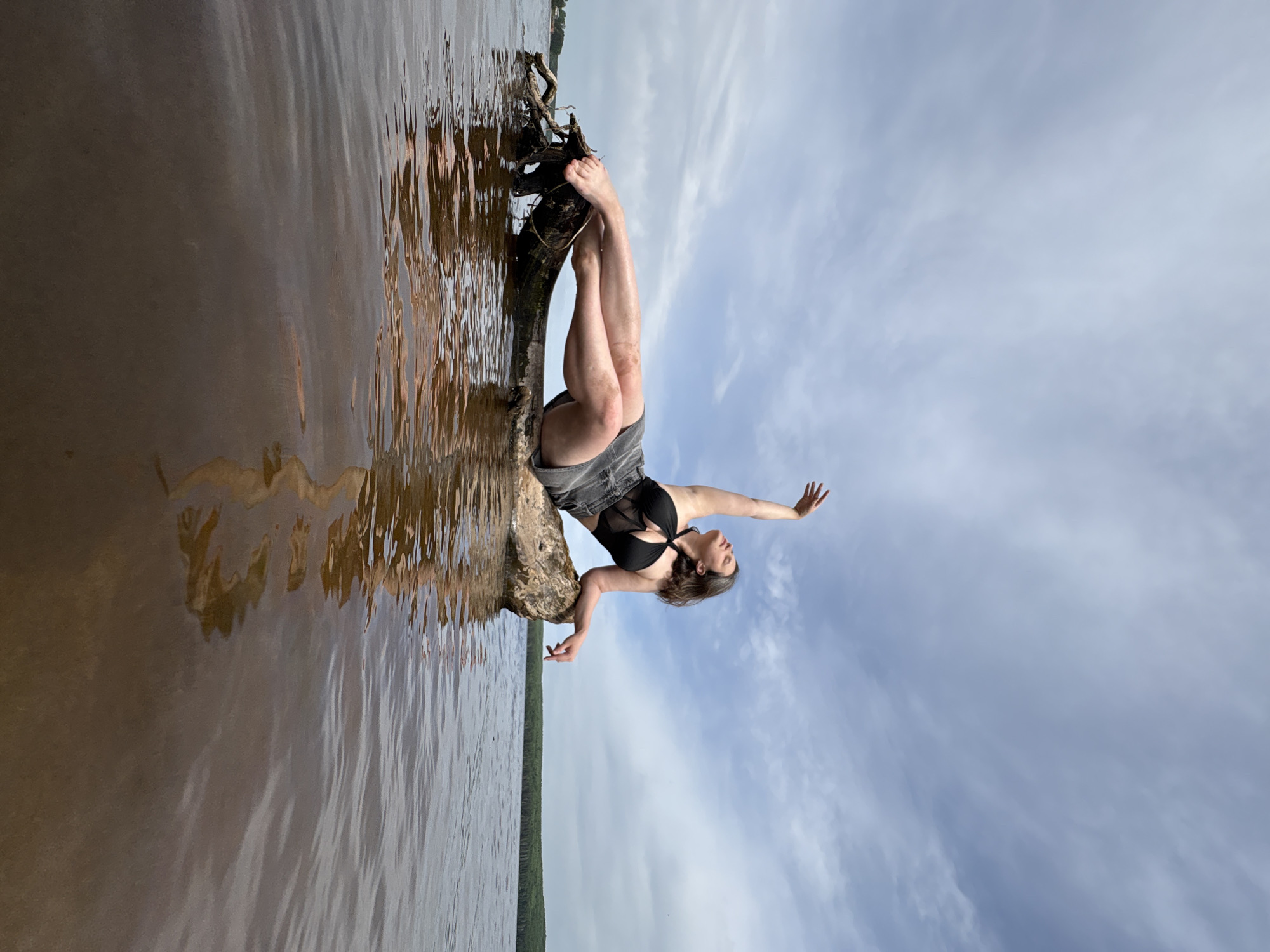 Woman poses for photos along Chaikovsky waterfront during morning