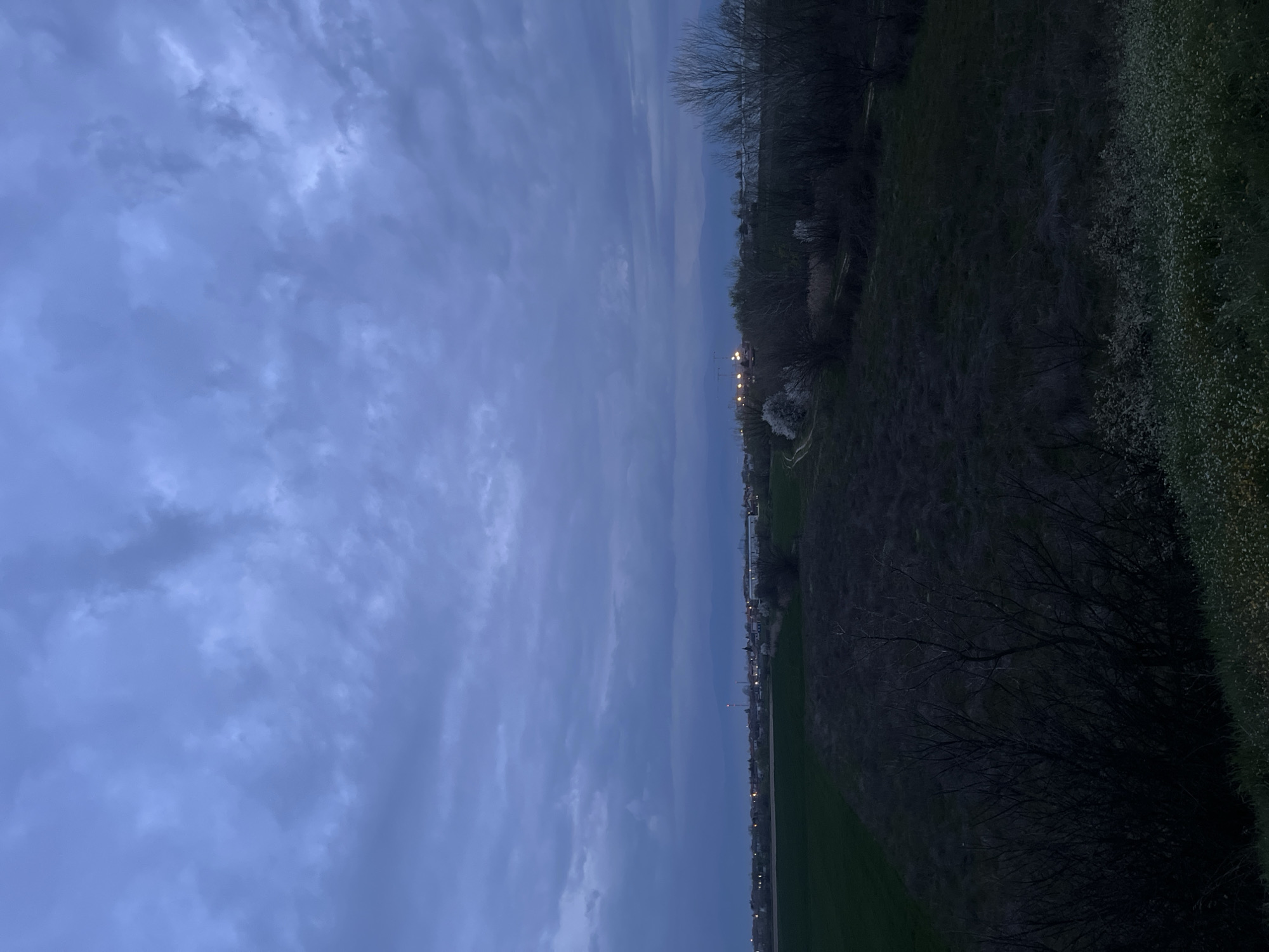 Spring blossoms meet stormy skies in Bulgarian countryside