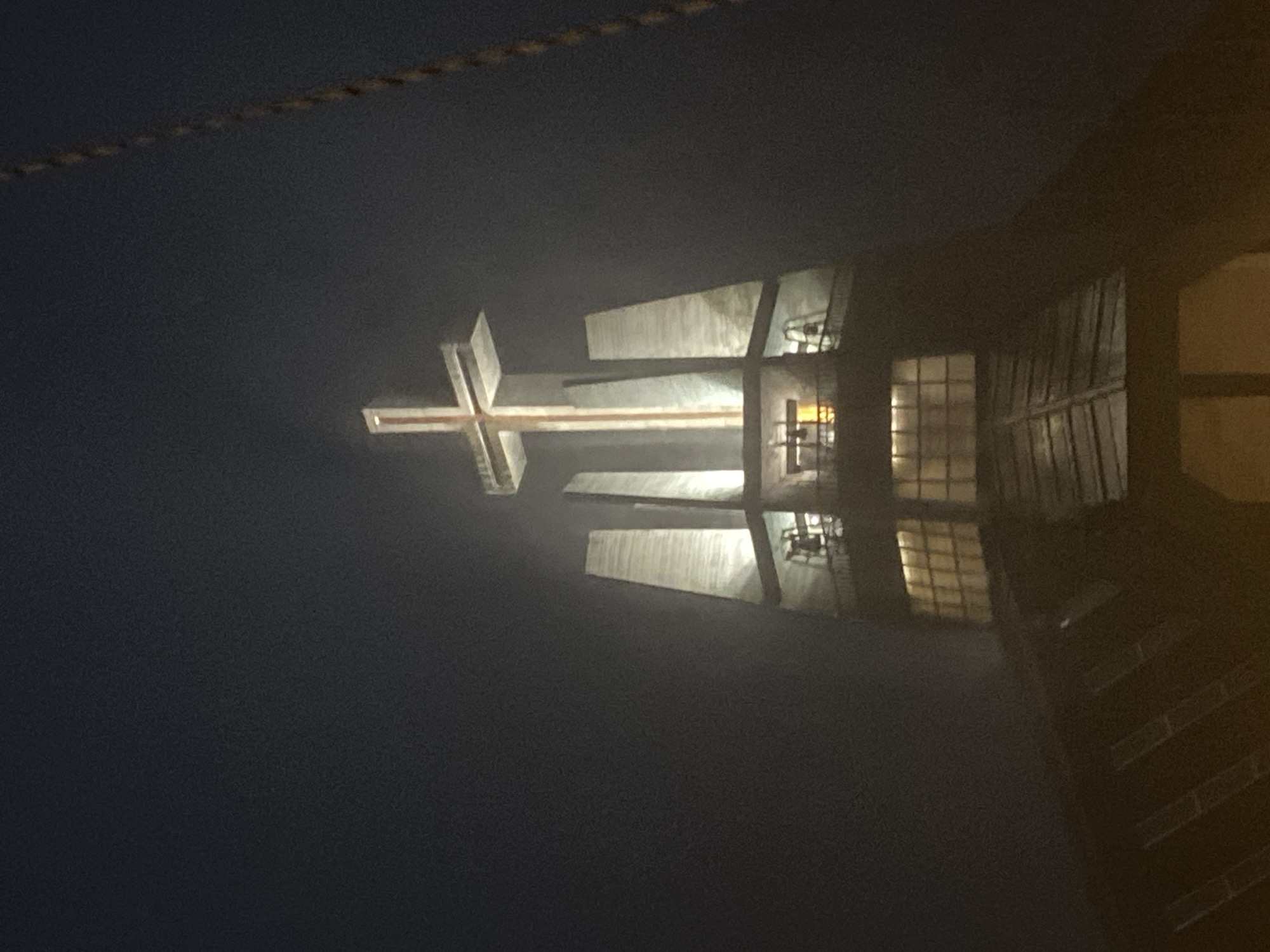 Stormy night at a modern illuminated church in Świdnica