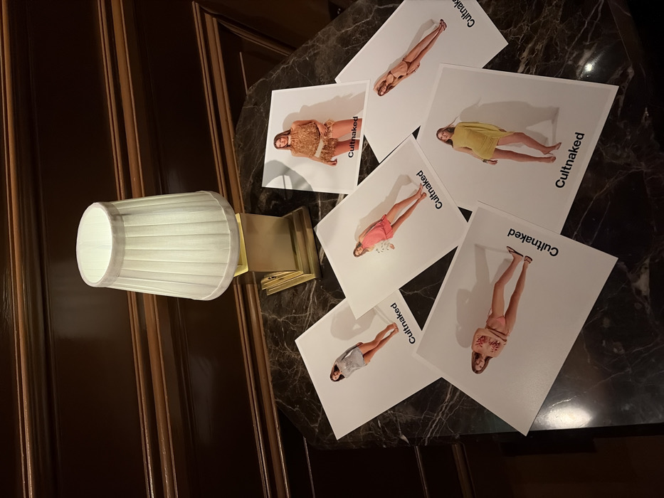 Fashion photos scattered on marble surface in London