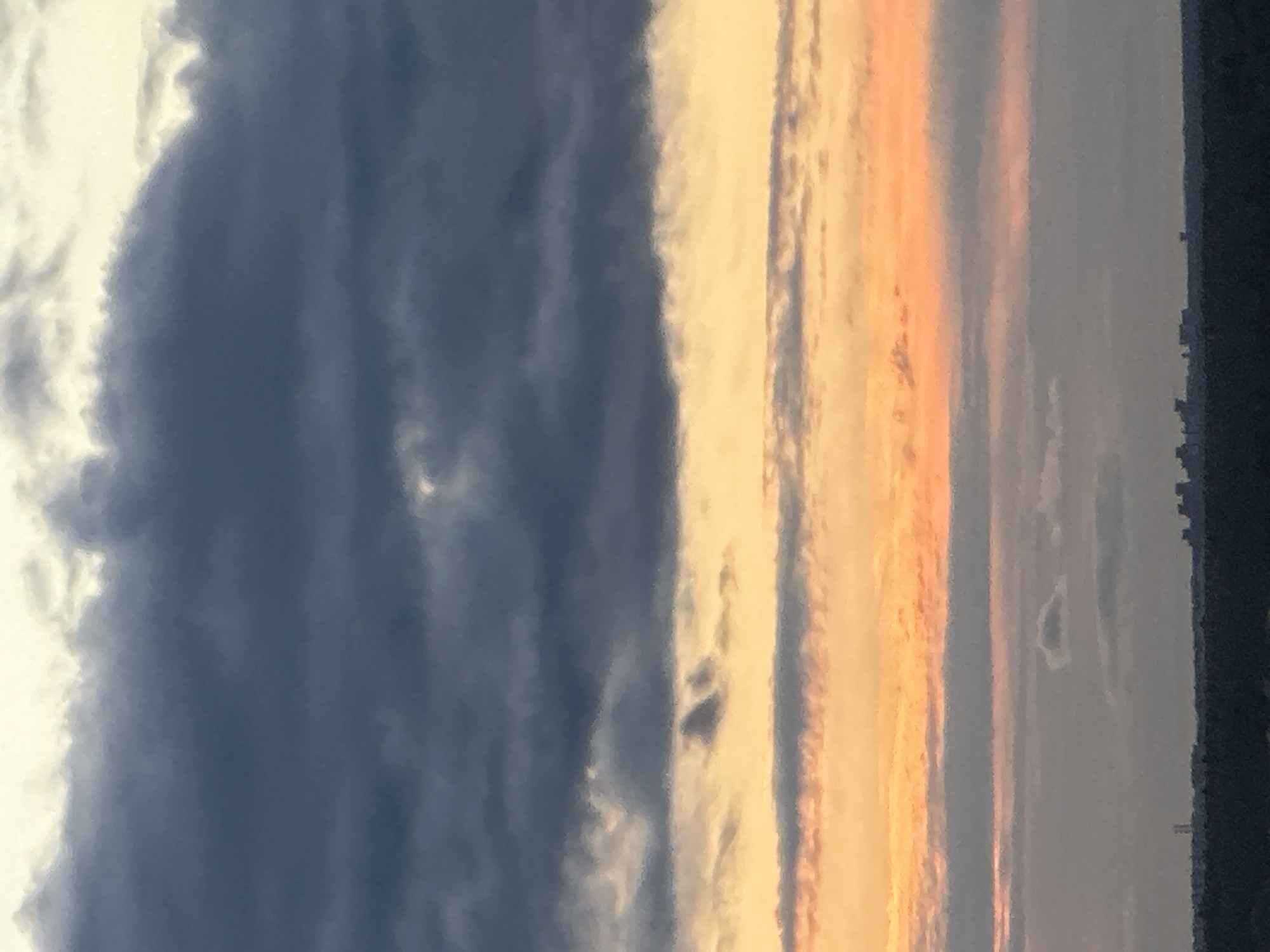 Sunset spreads across Podolsk in warm layers of color