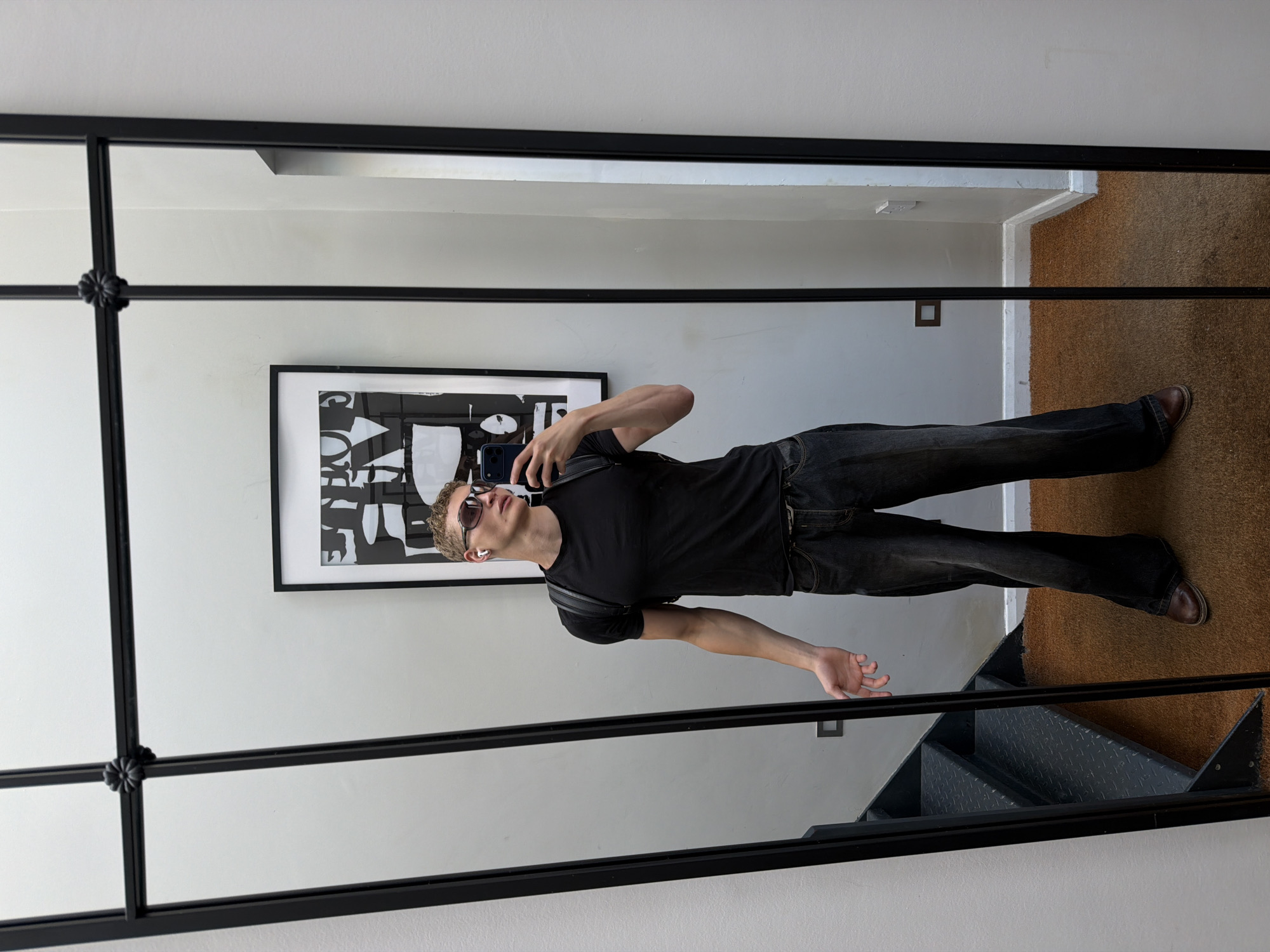 Mirror selfies in a London room, early morning