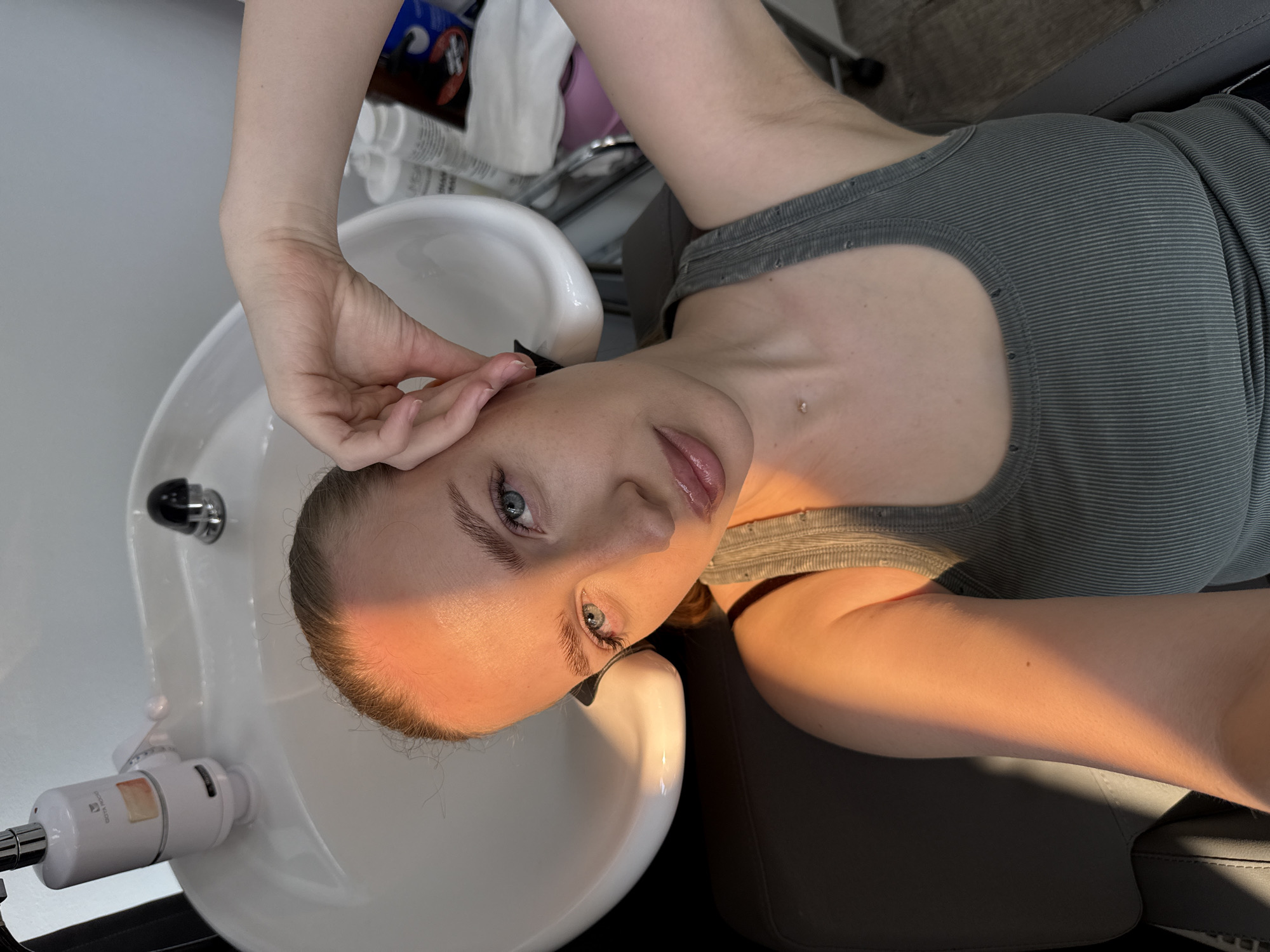 Woman takes selfie at hair salon in Petropavlovsk-Kamchatsky