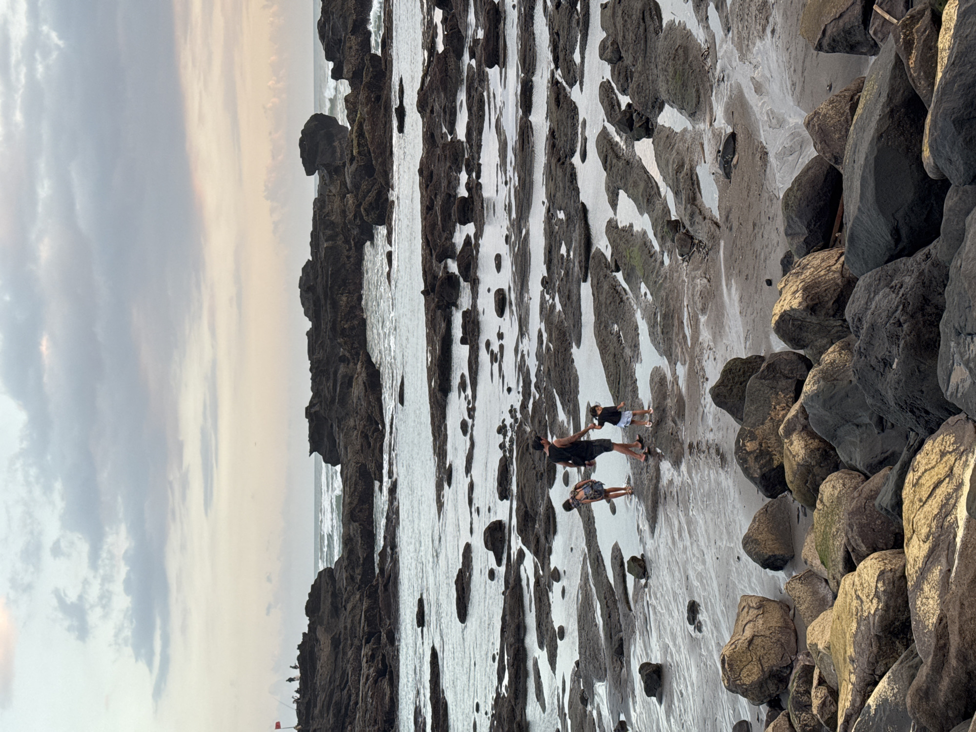 Peaceful rocky coastline documented in Mengwi, Indonesia
