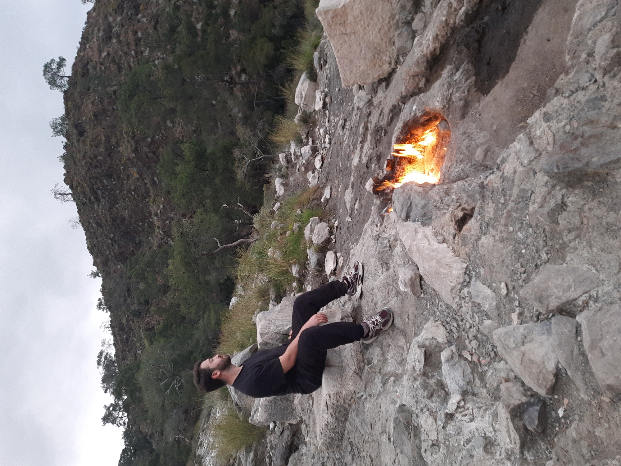 Visitor observes natural flames at Turkey's ancient Chimaera site