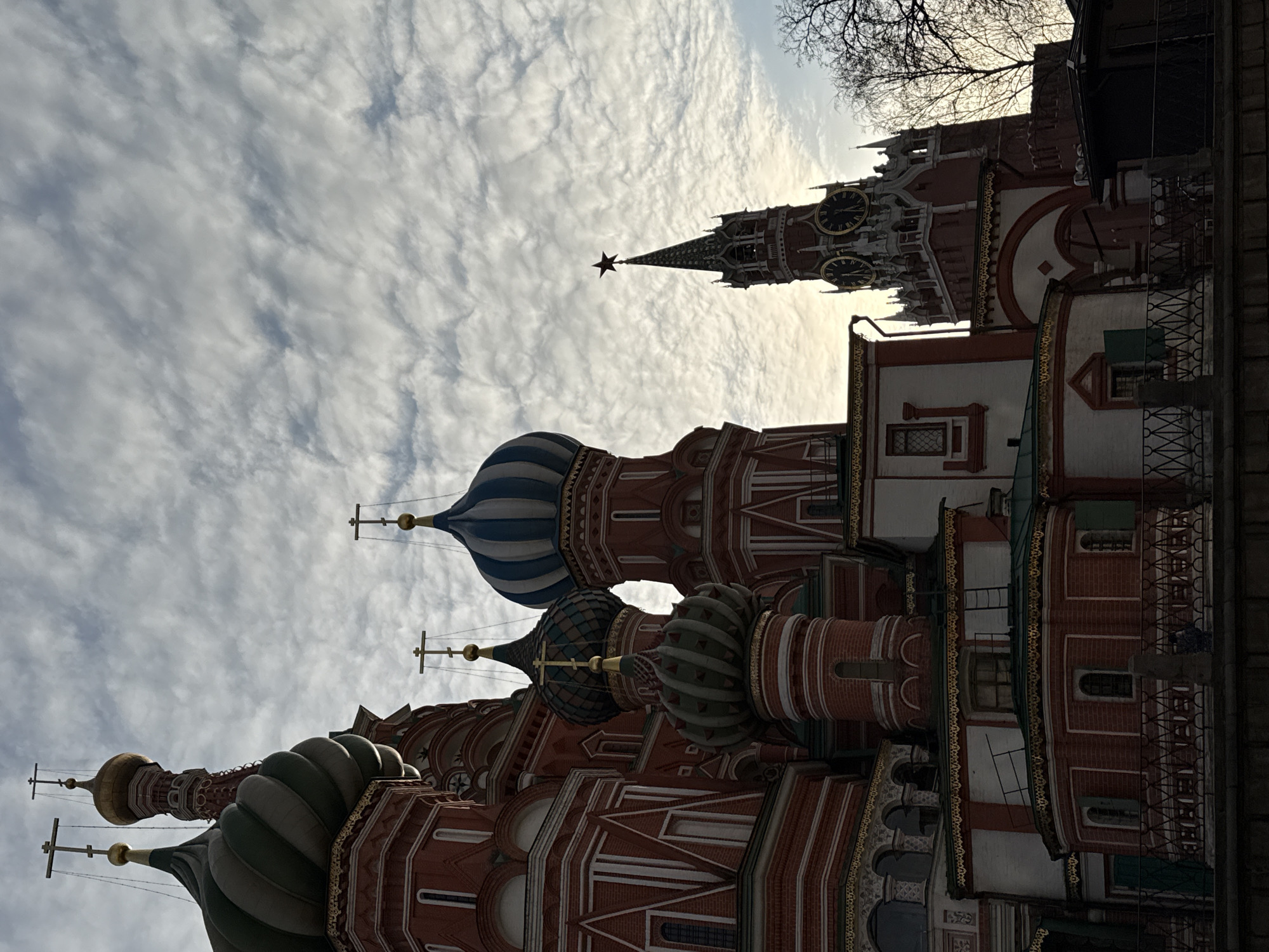 Tourists photograph St. Basil's Cathedral in Moscow's Red Square
