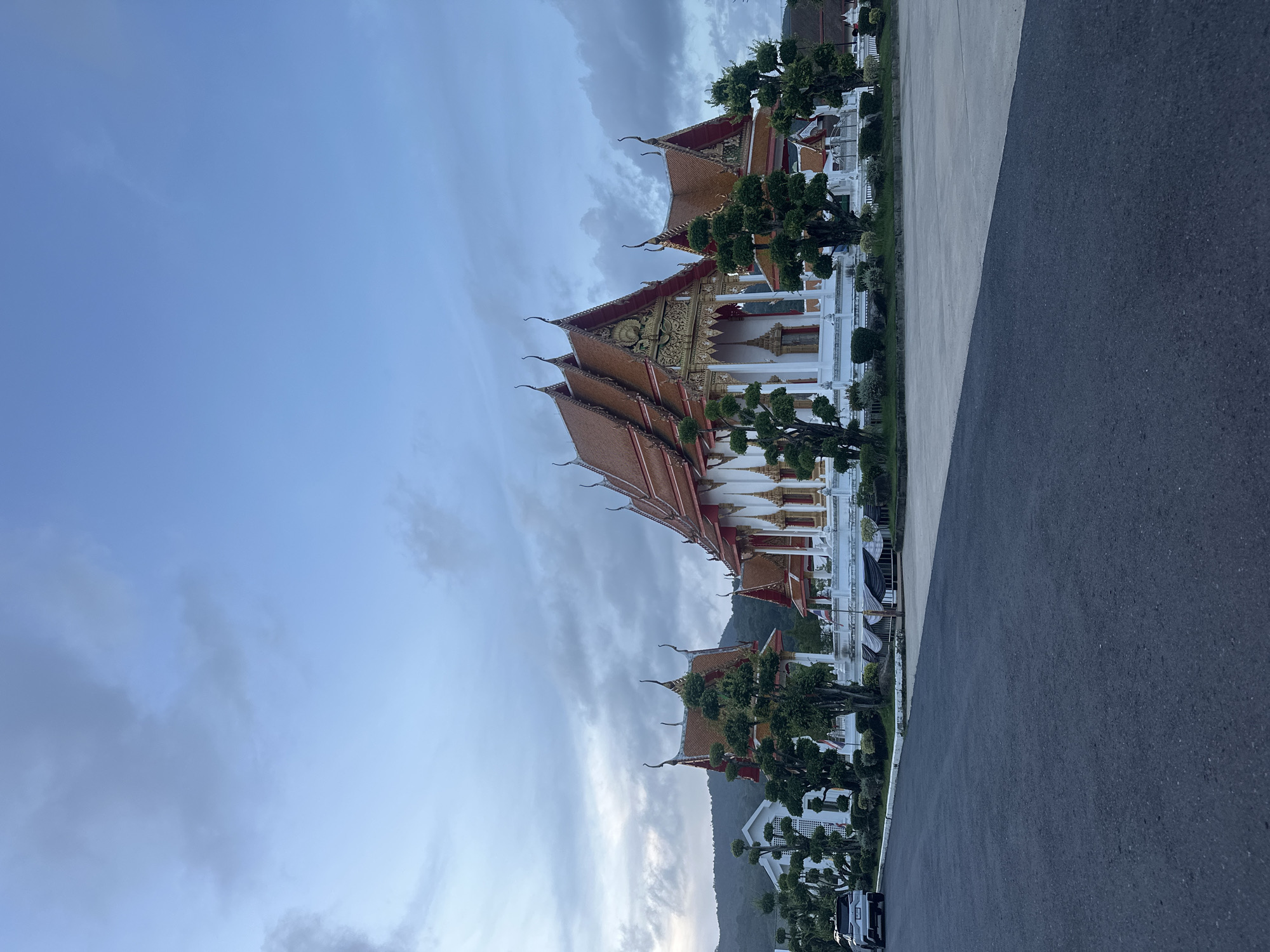 Visitors document prayer scenes at Wat Chalong temple Thailand
