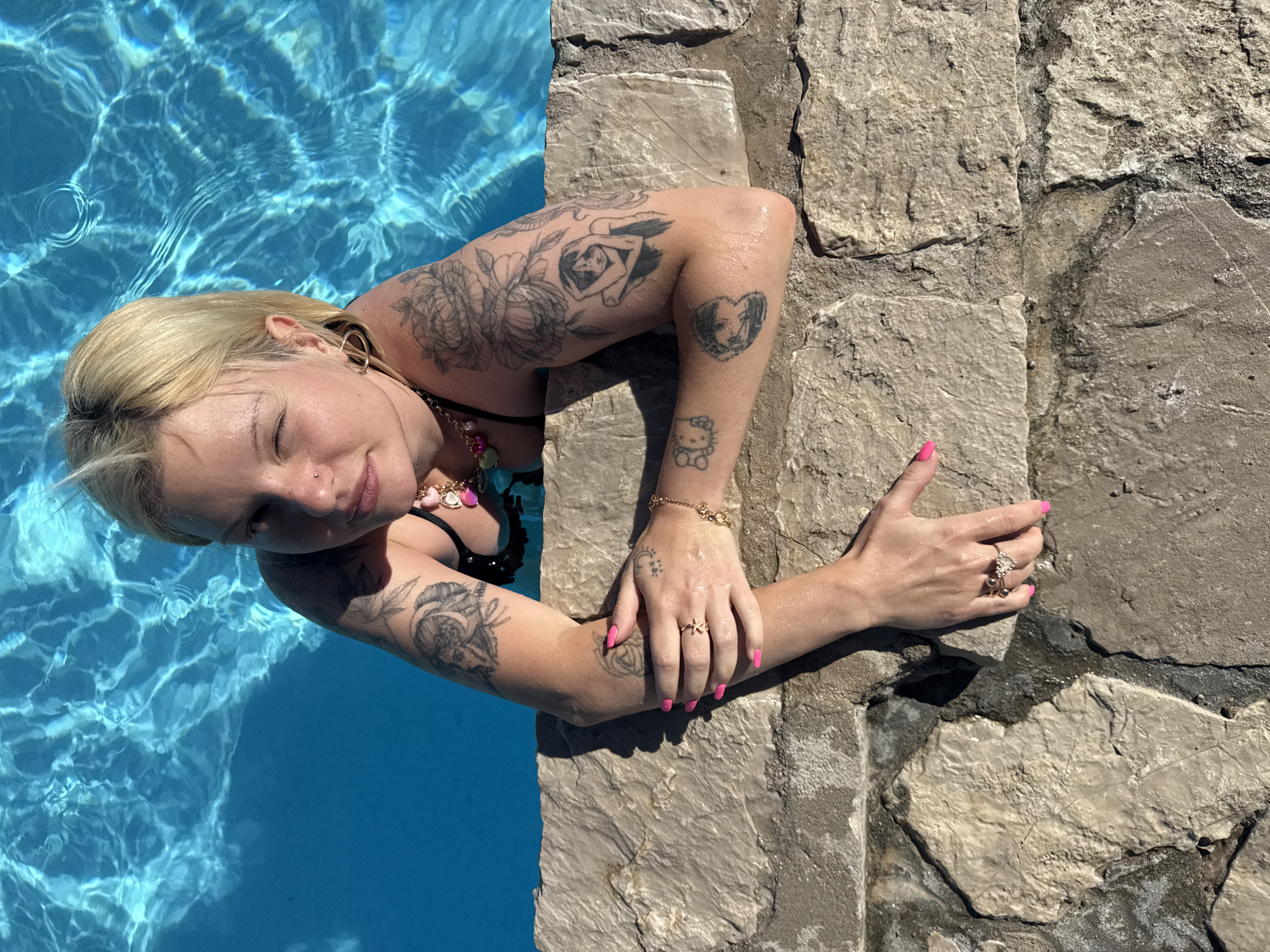 Woman enjoys afternoon swim at Prijevor beach resort