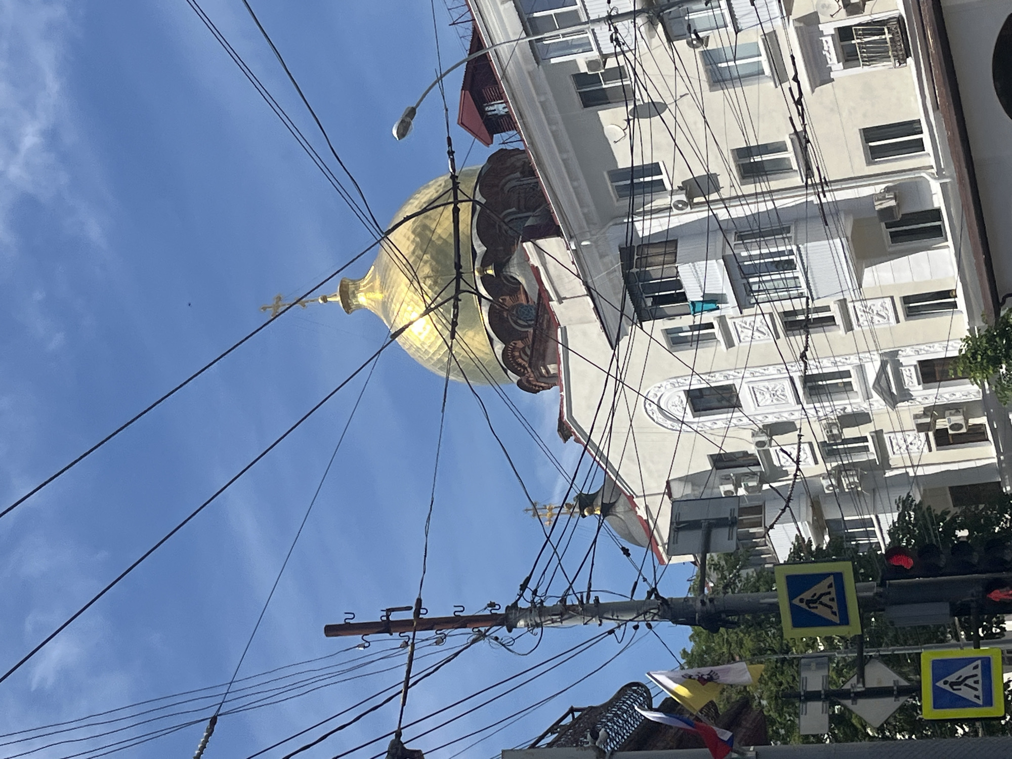 Daily street scenes documented across Krasnodar during sunny afternoon