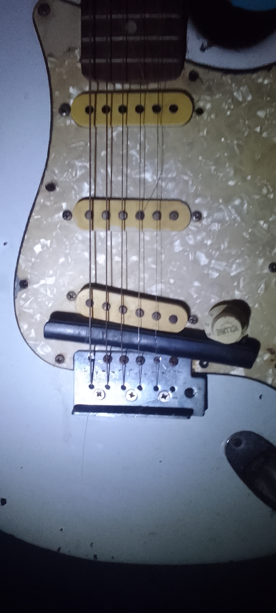 Close-up details of guitars, gadgets, and everyday objects